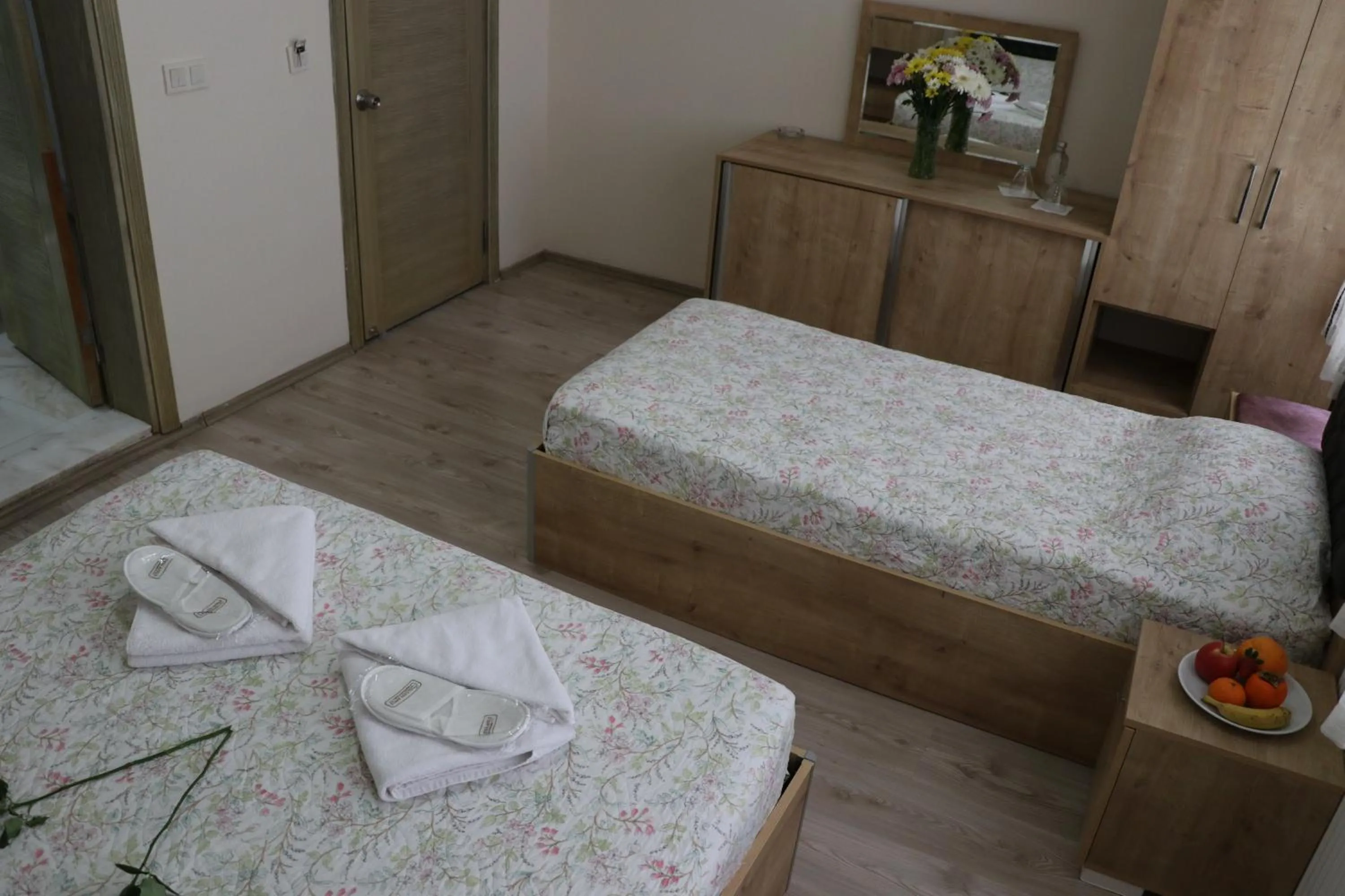 Bed in Golden Apple Hotel