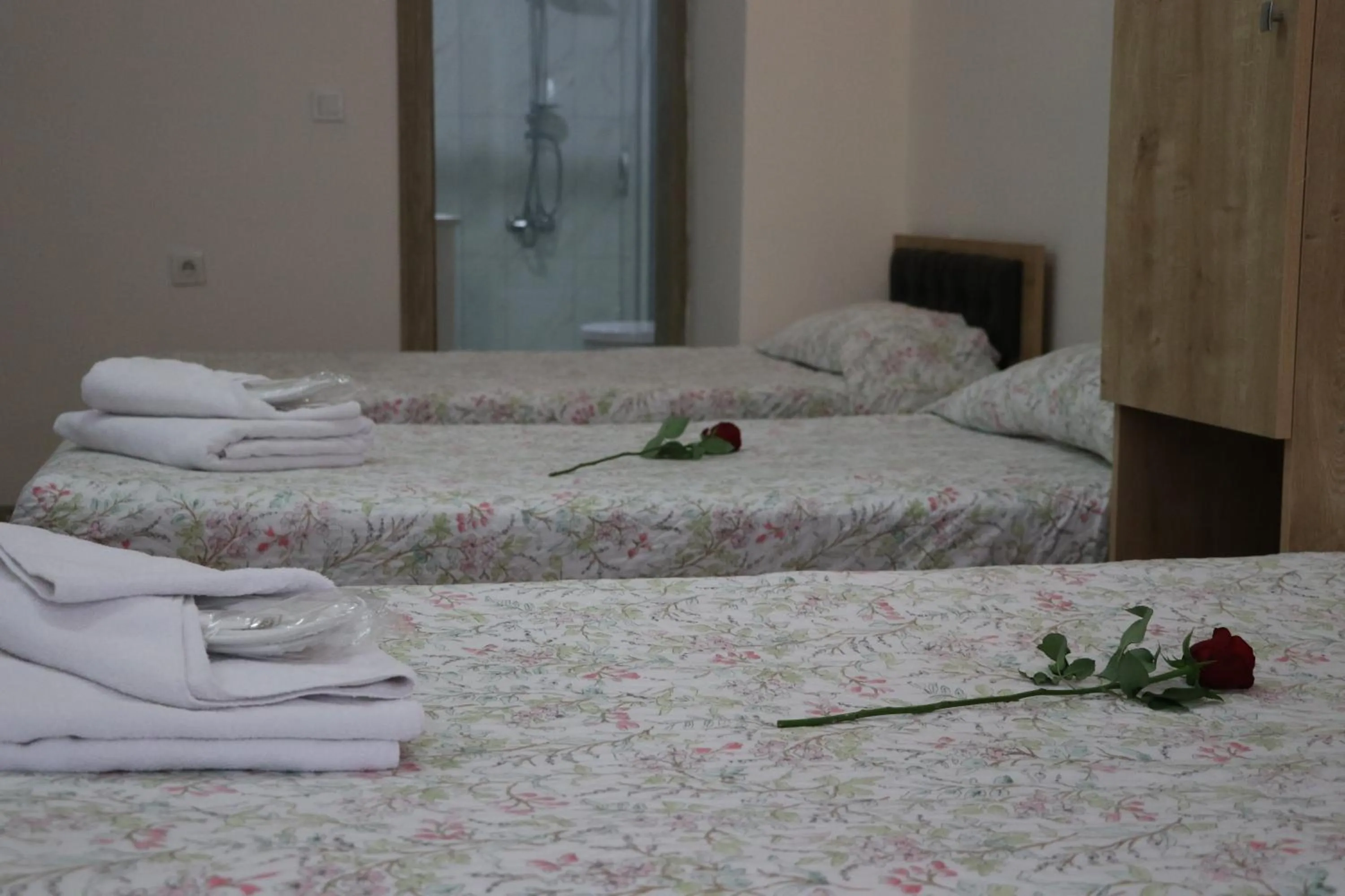 Bed in Golden Apple Hotel
