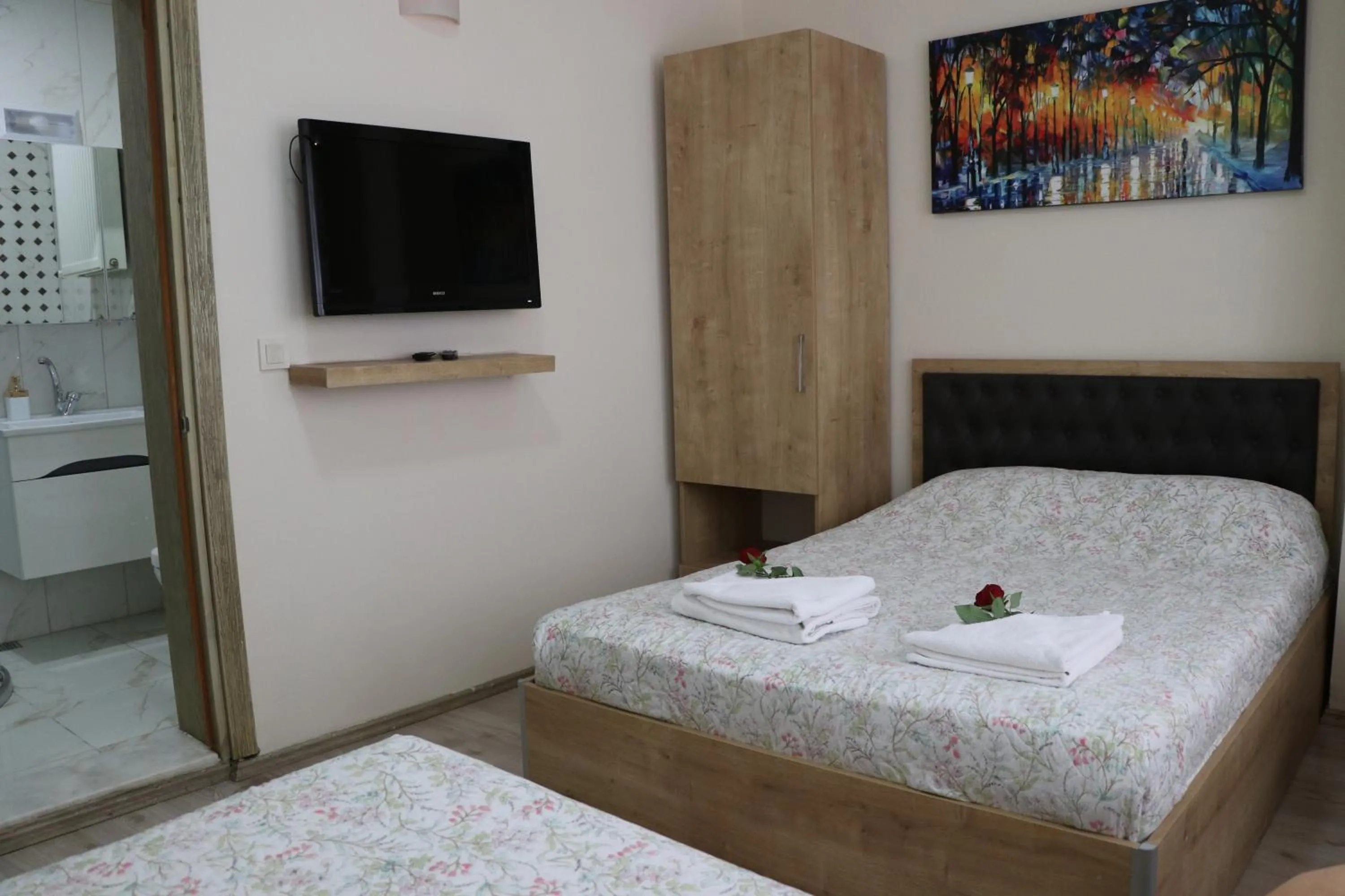 Bed in Golden Apple Hotel