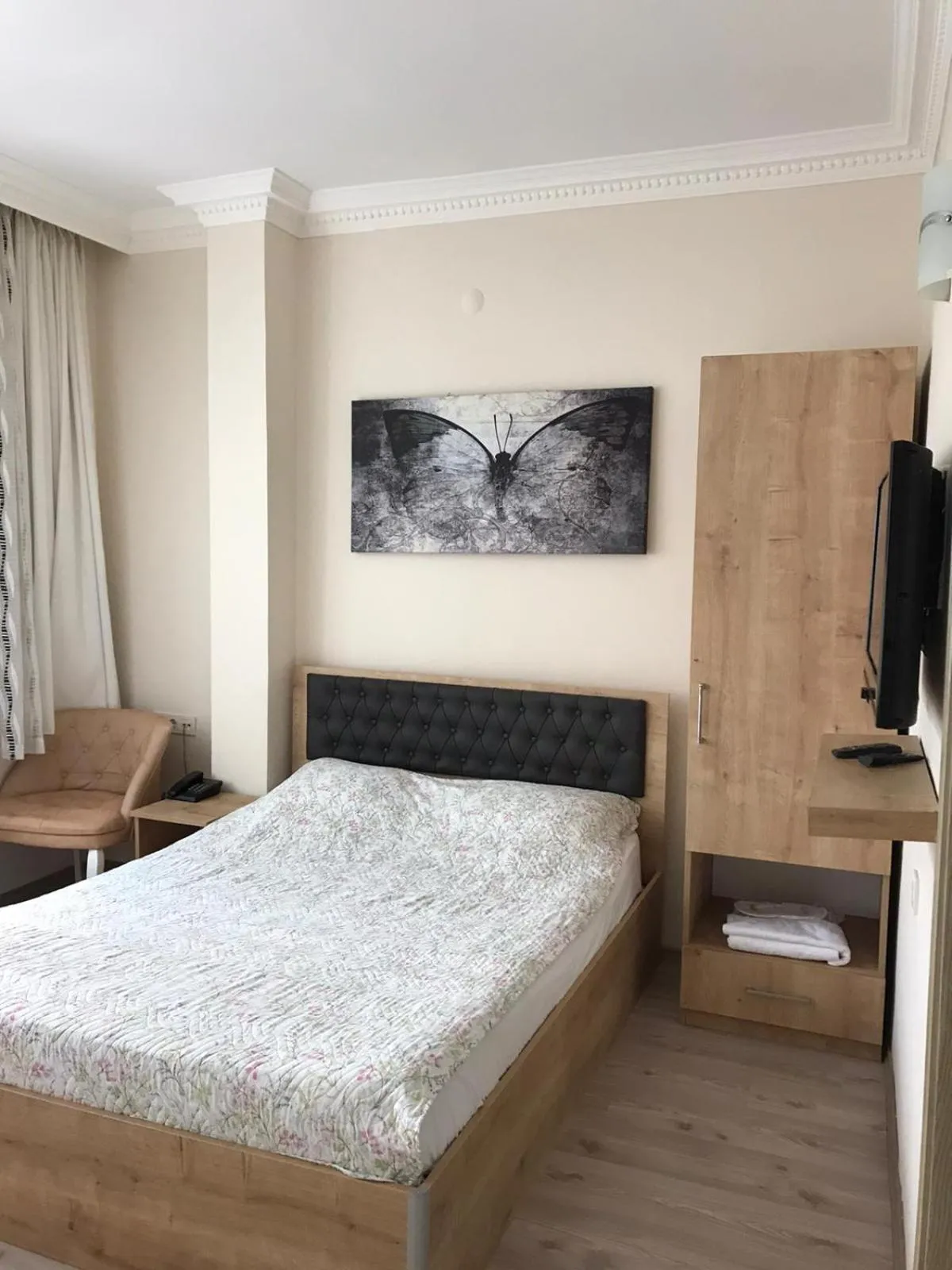 Bed in Golden Apple Hotel
