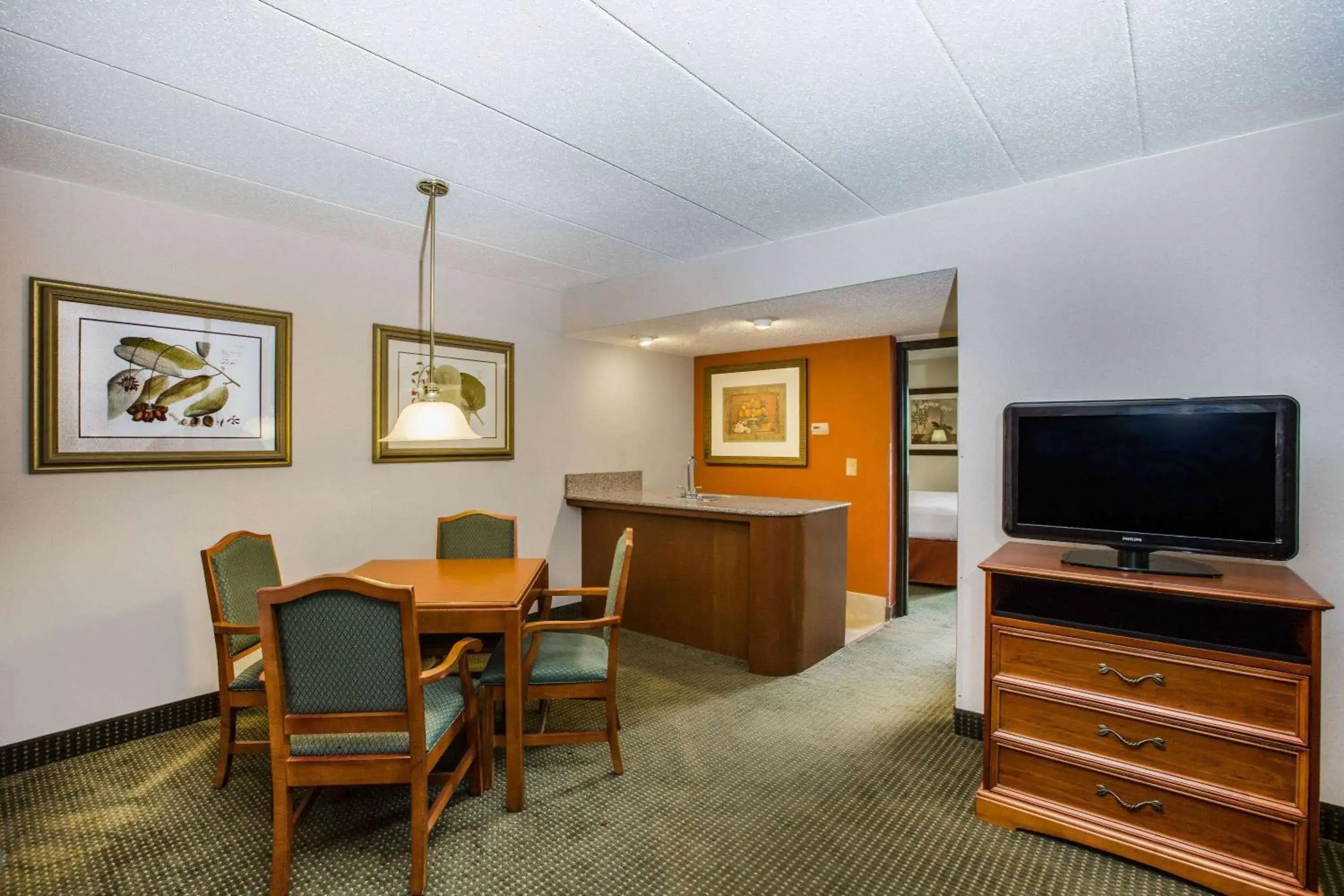Living room in AmericInn by Wyndham Omaha Living room in AmericInn by Wyndham Omaha