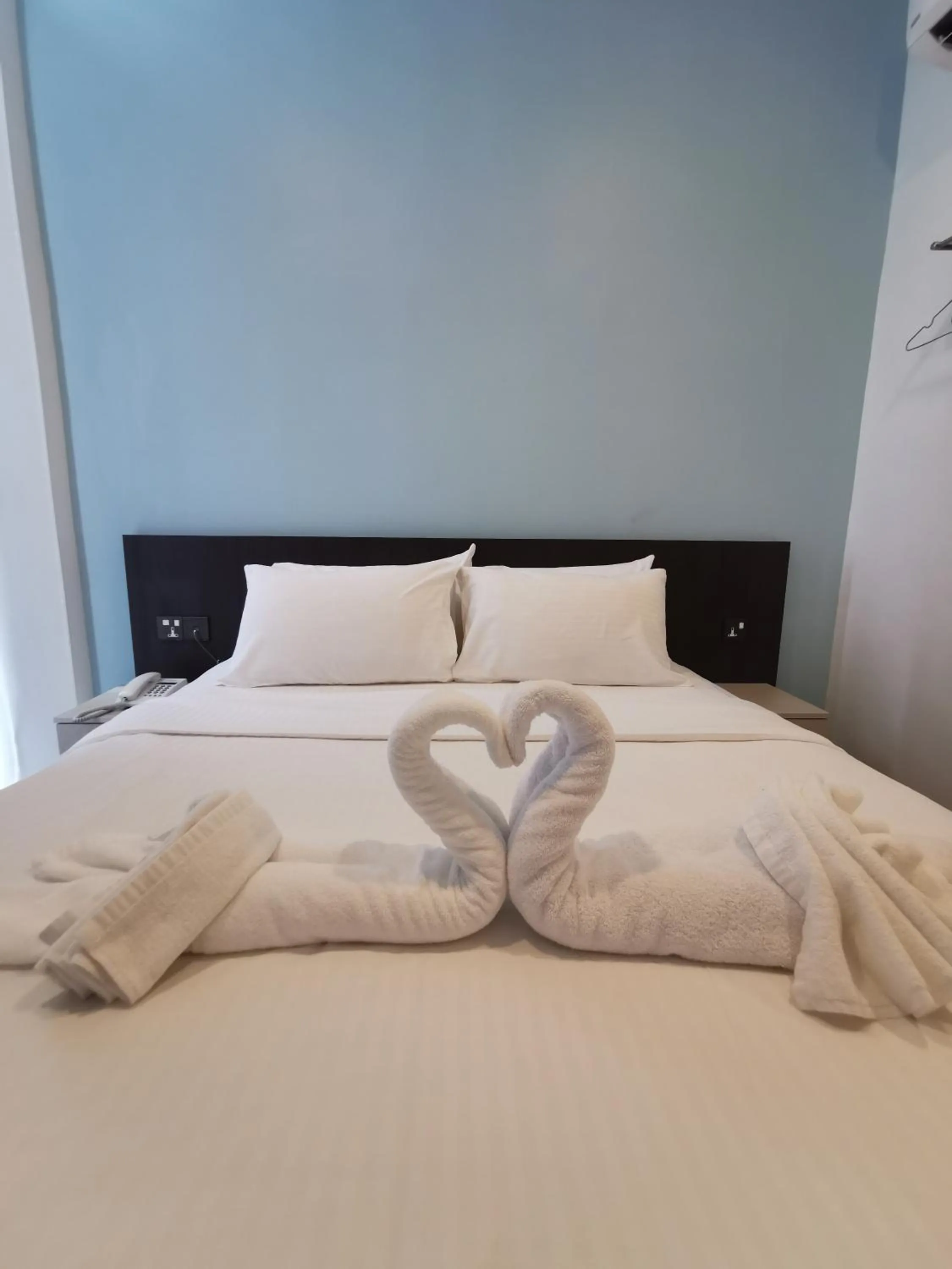 Bed in TT Dorf Hotel Matang