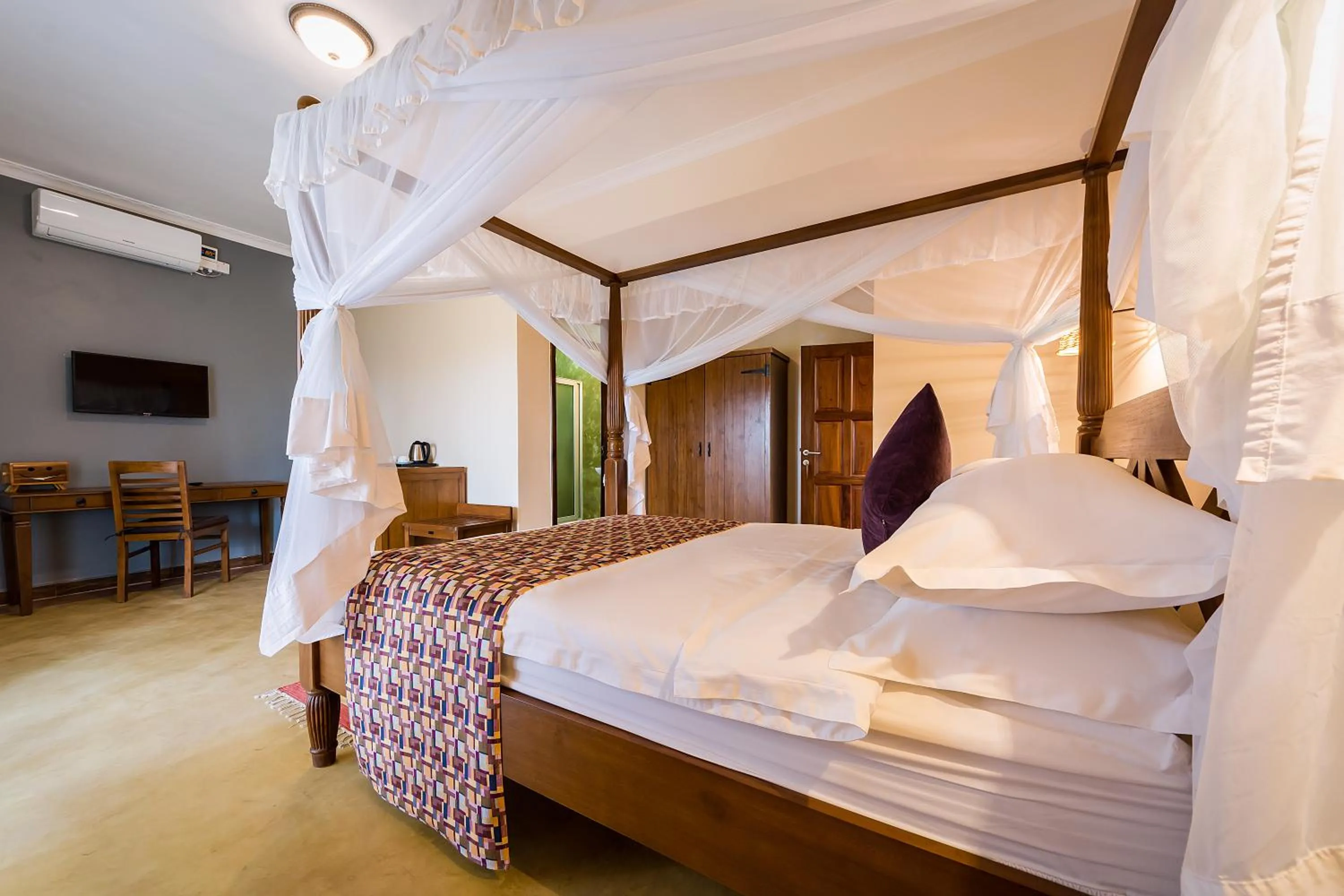 Bed in Emburara Farm Lodge