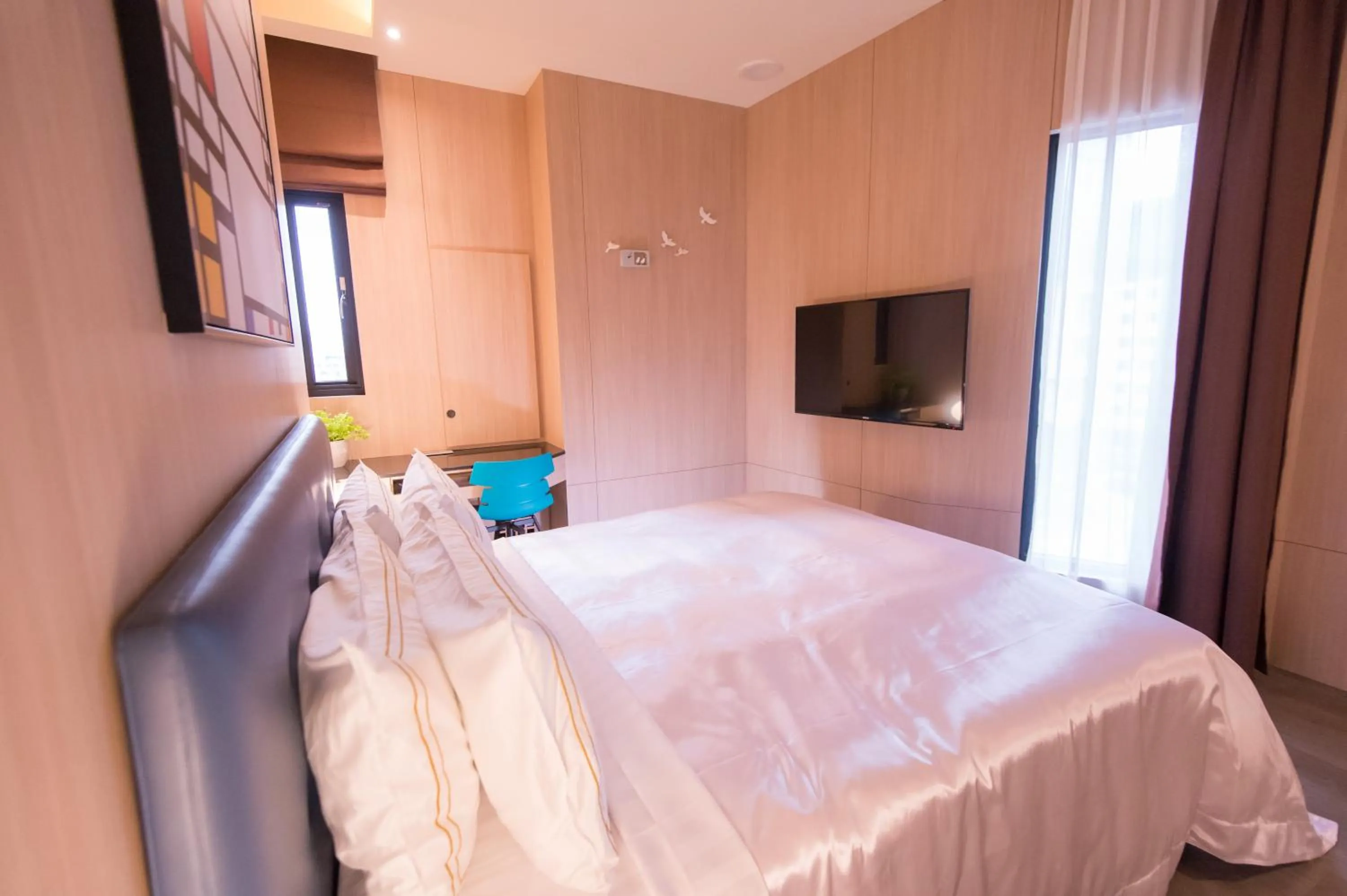 Bed in J Moon Villa Motel