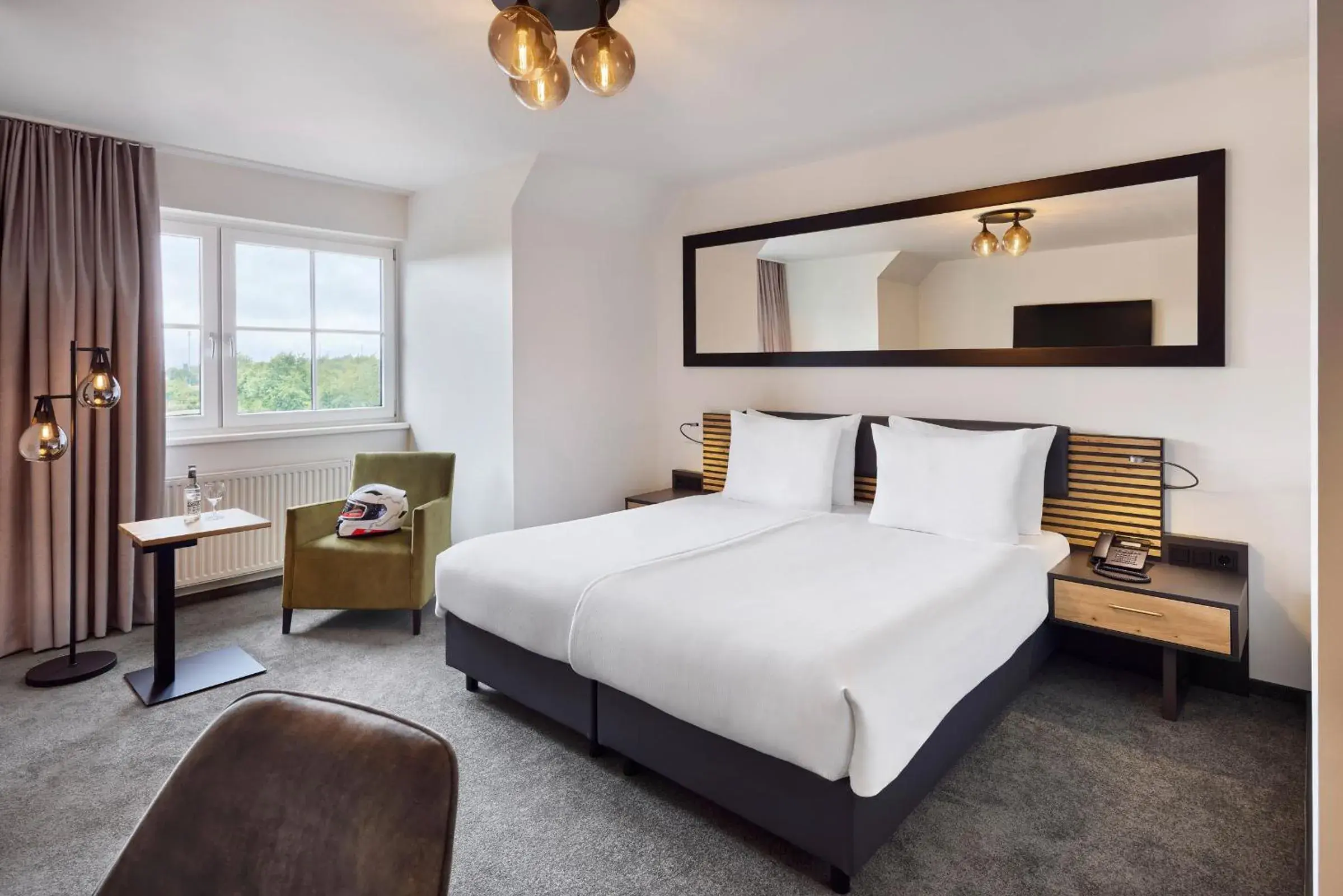 Photo of the whole room, Bed in Nürburgring Motorsport Hotel Photo of the whole room, Bed in Nürburgring Motorsport Hotel