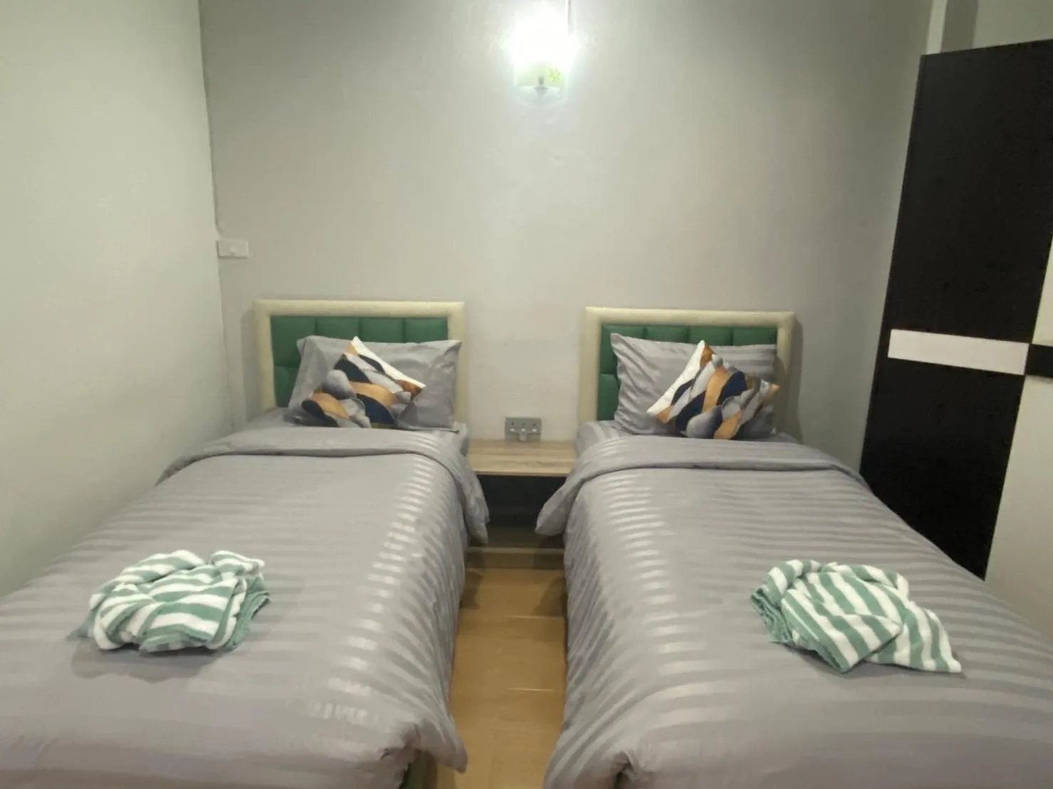 Bed in Alongkorn hotel by SB