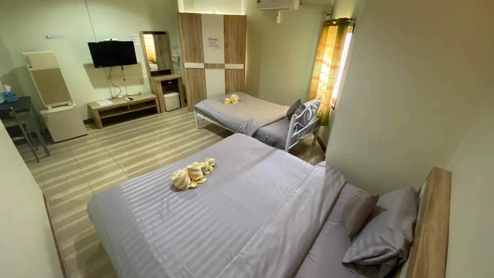 Bed in Alongkorn hotel by SB