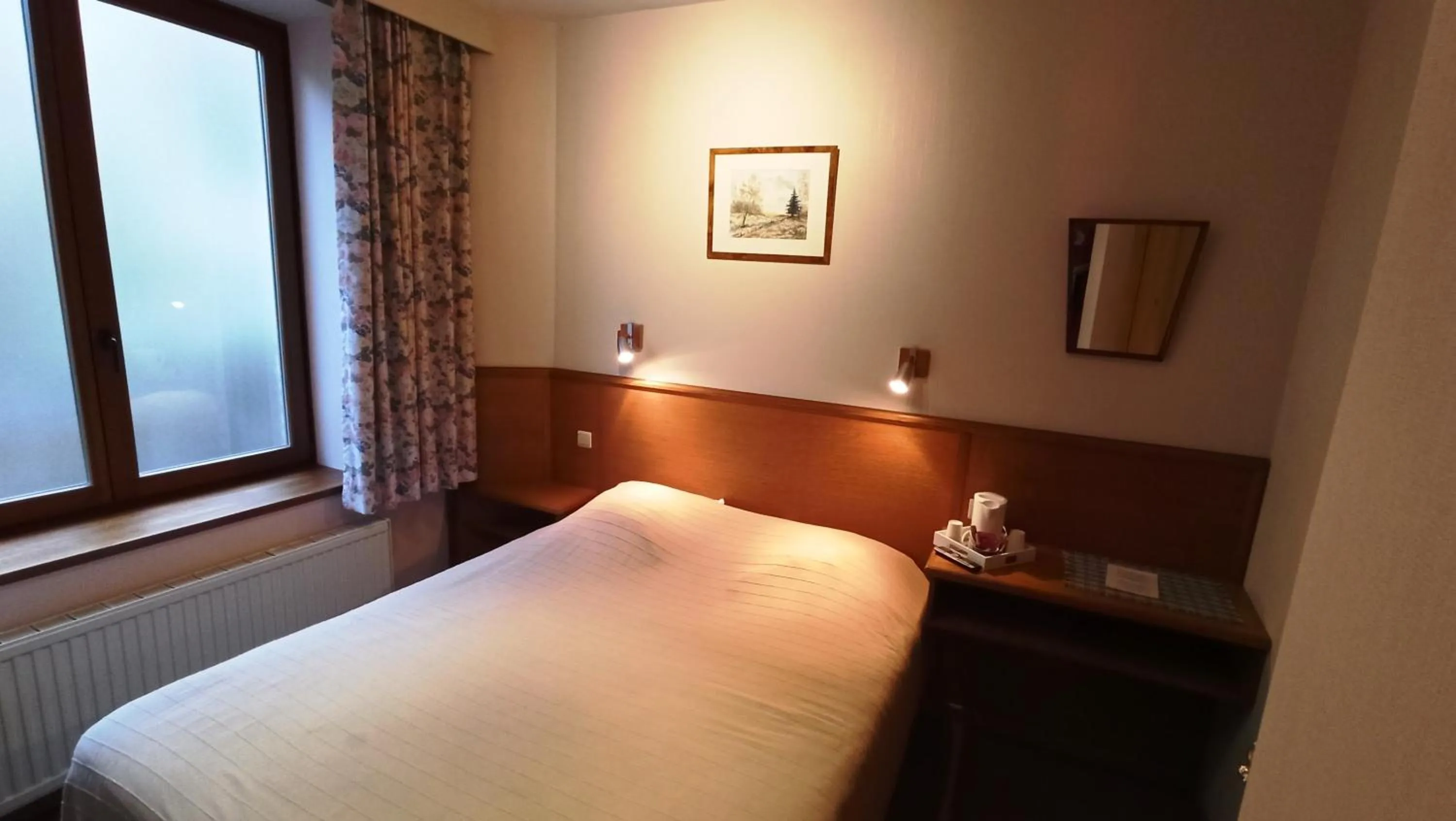 Bed in Hotel Le Chalet