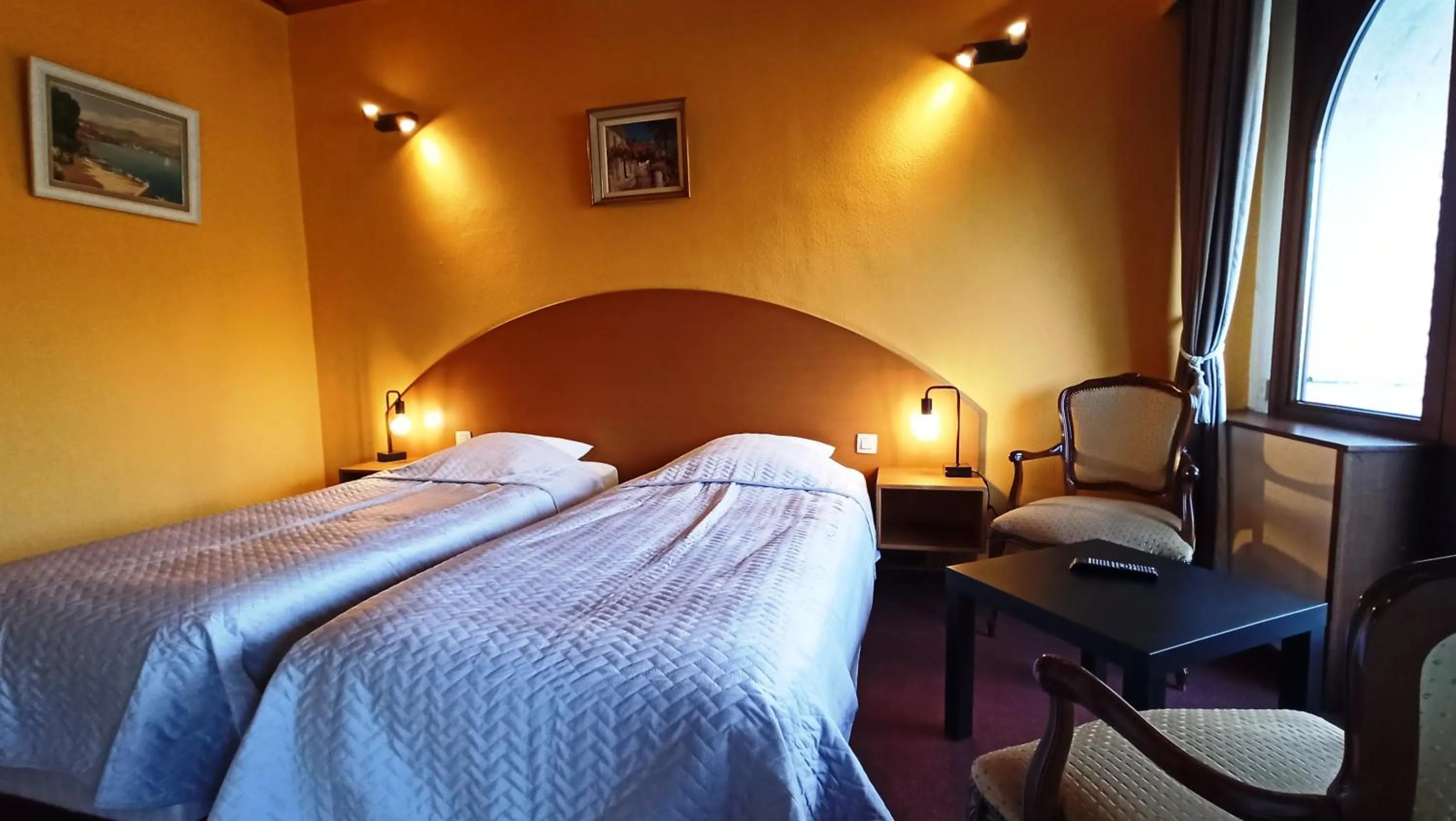 Bed in Hotel Le Chalet