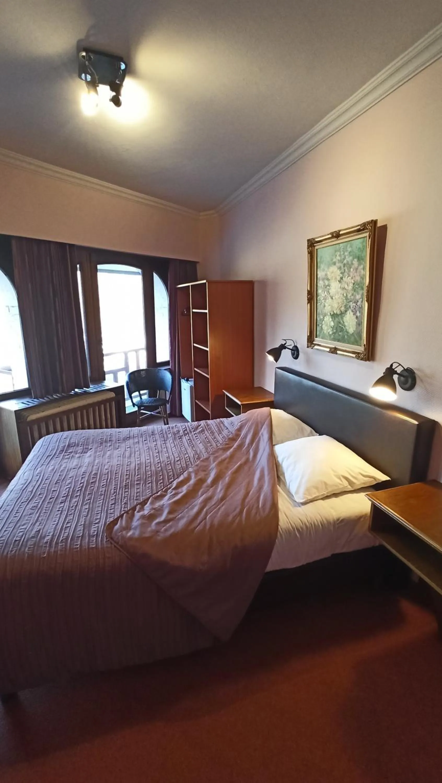 Bed in Hotel Le Chalet