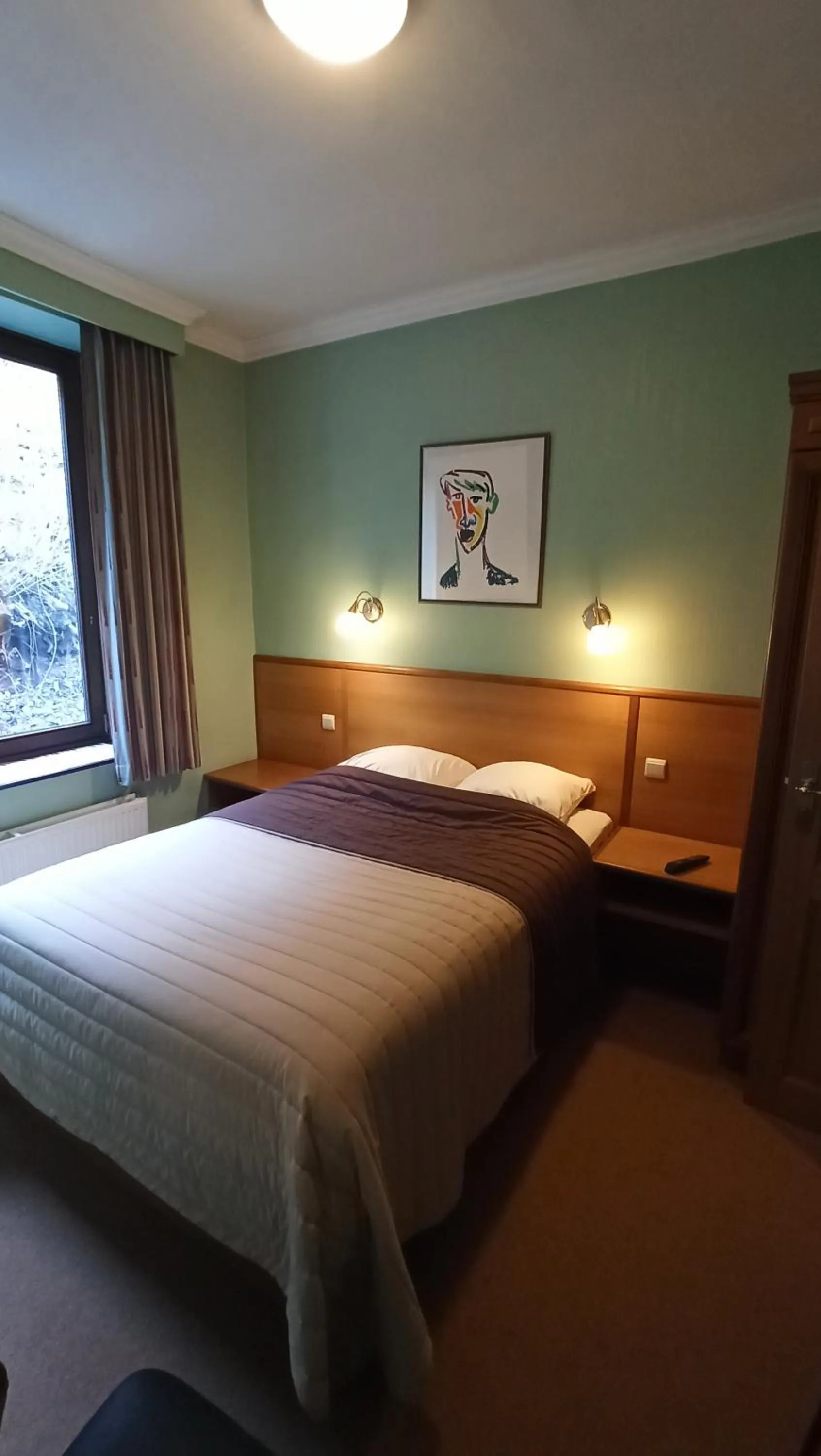 Bed in Hotel Le Chalet