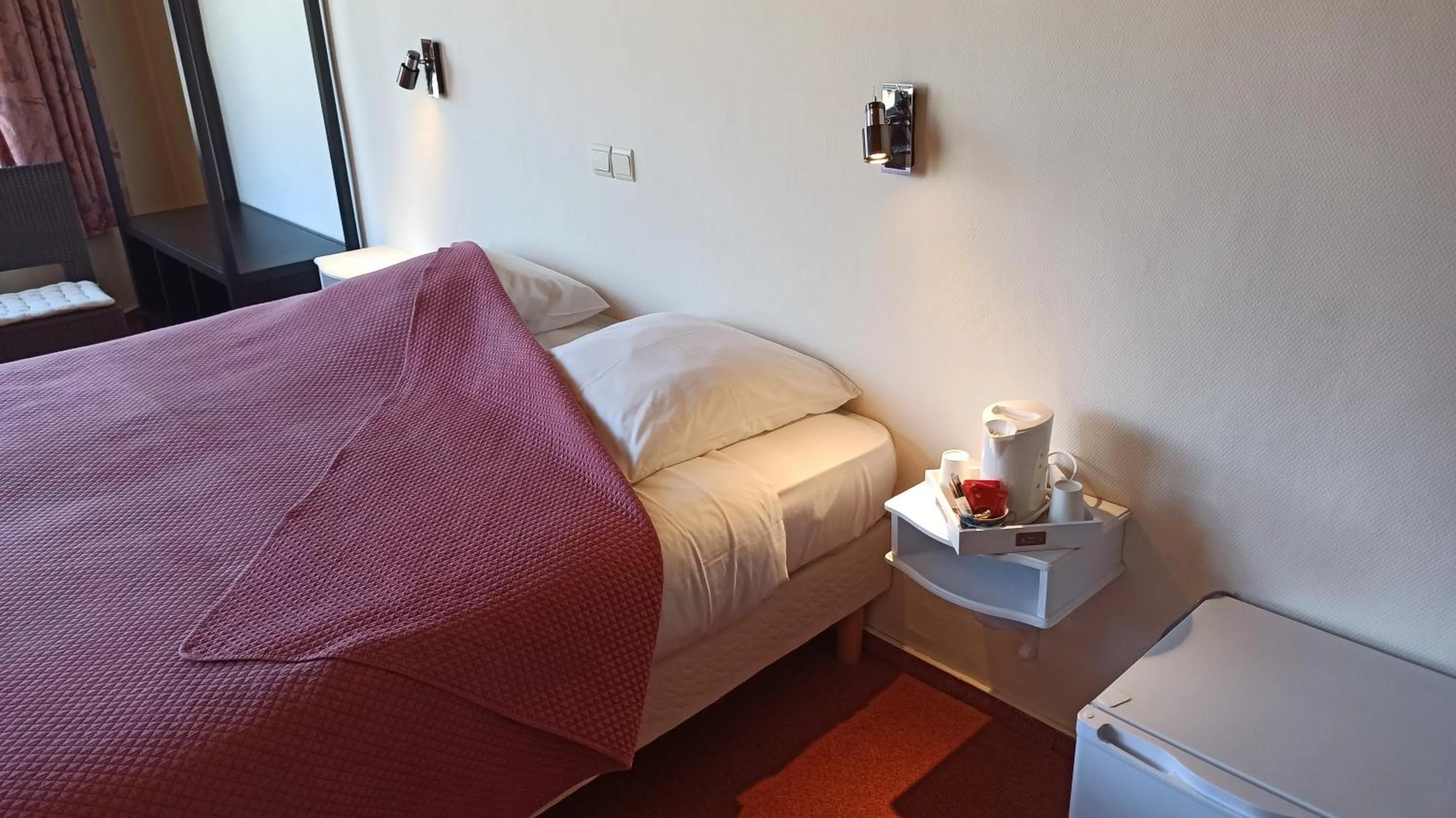 Bed in Hotel Le Chalet