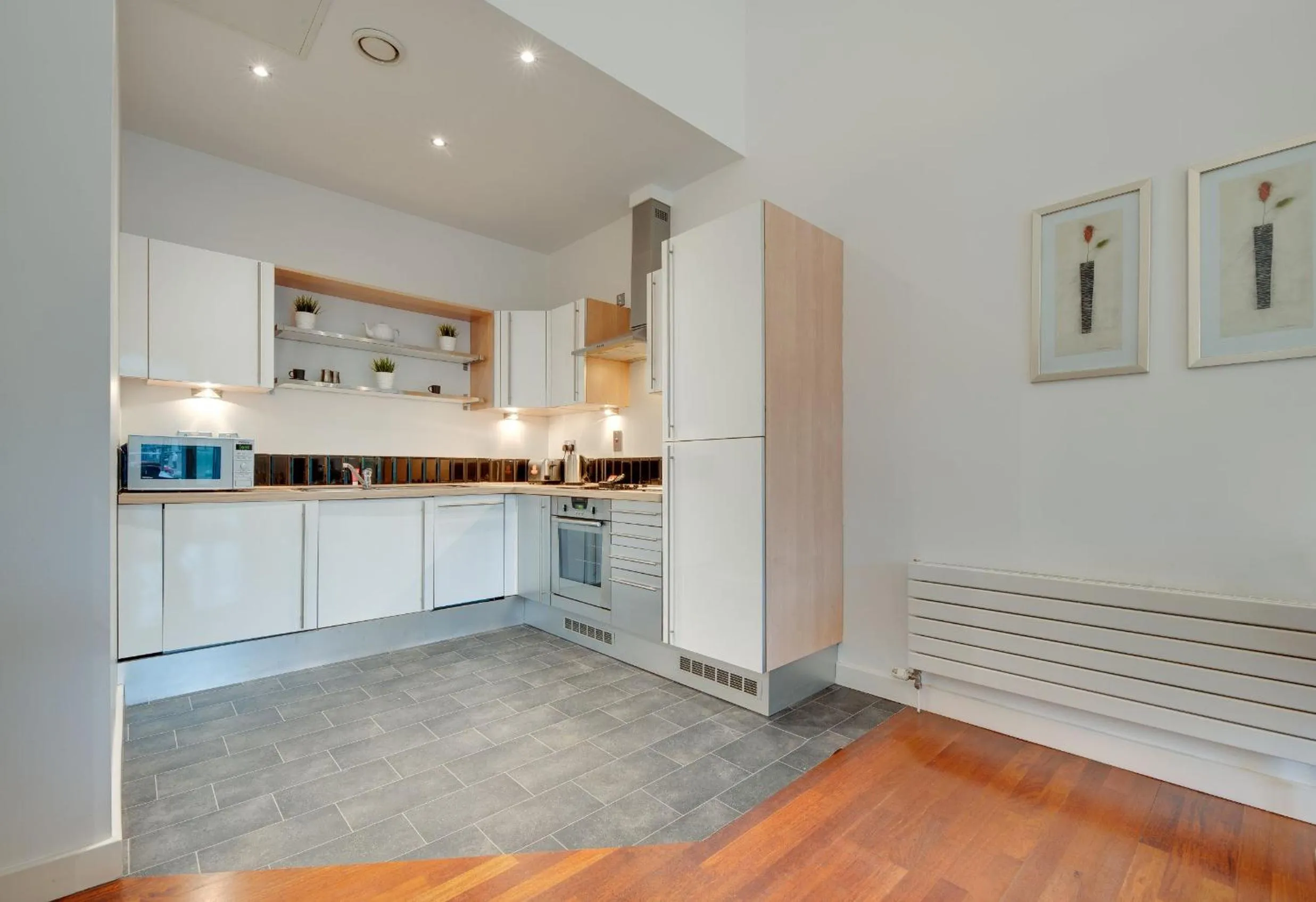 Kitchen or kitchenette in Crown Apartments 1C by Week2Week