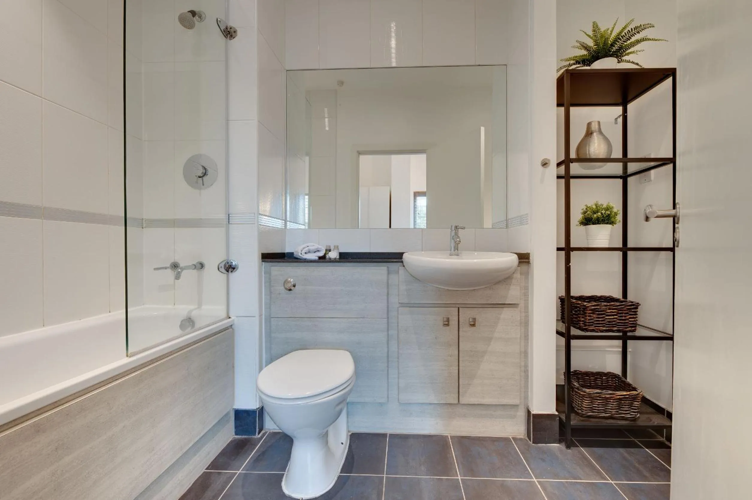 Bathroom in Crown Apartments 1C by Week2Week