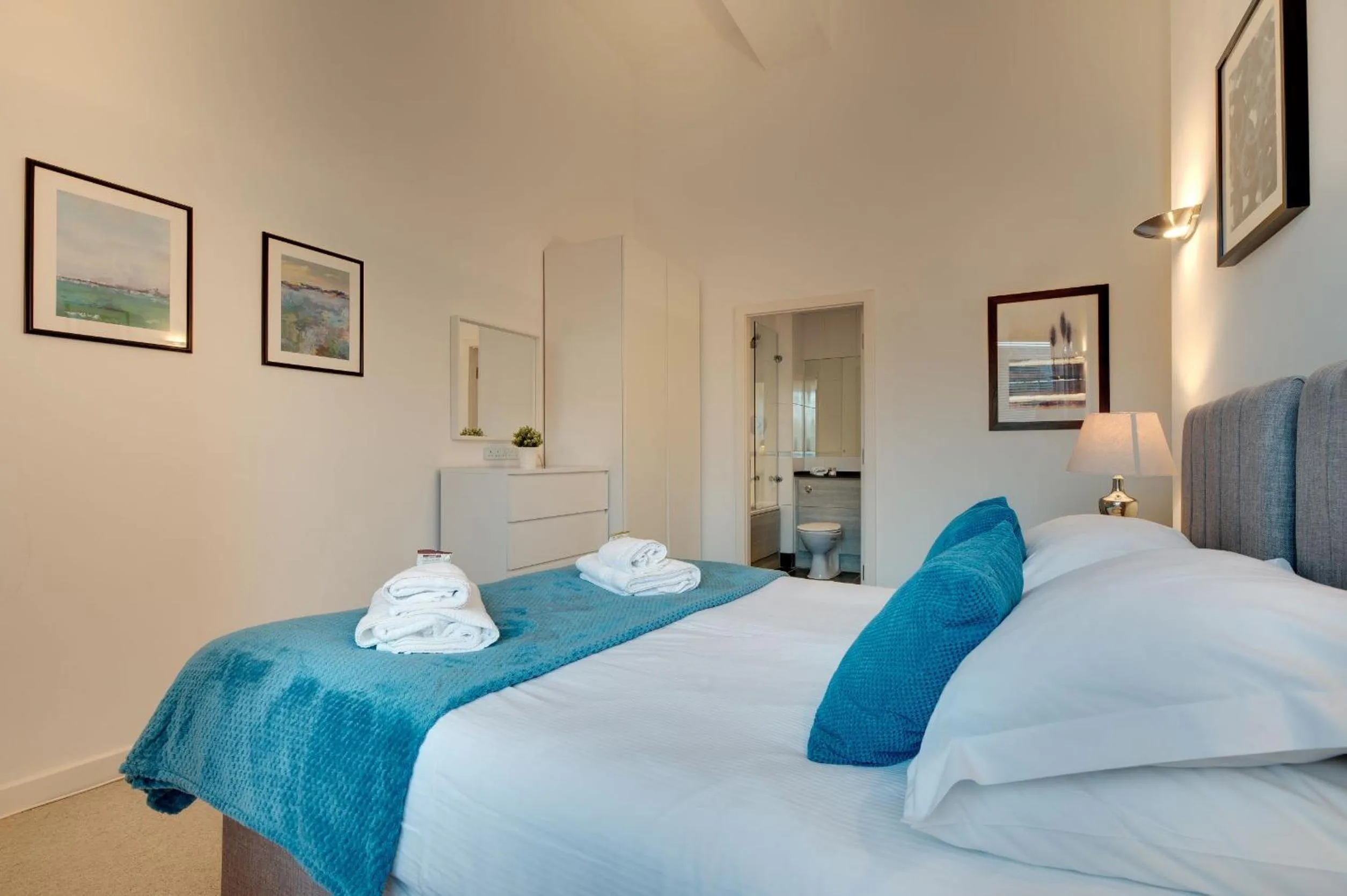 Bed in Crown Apartments 1C by Week2Week