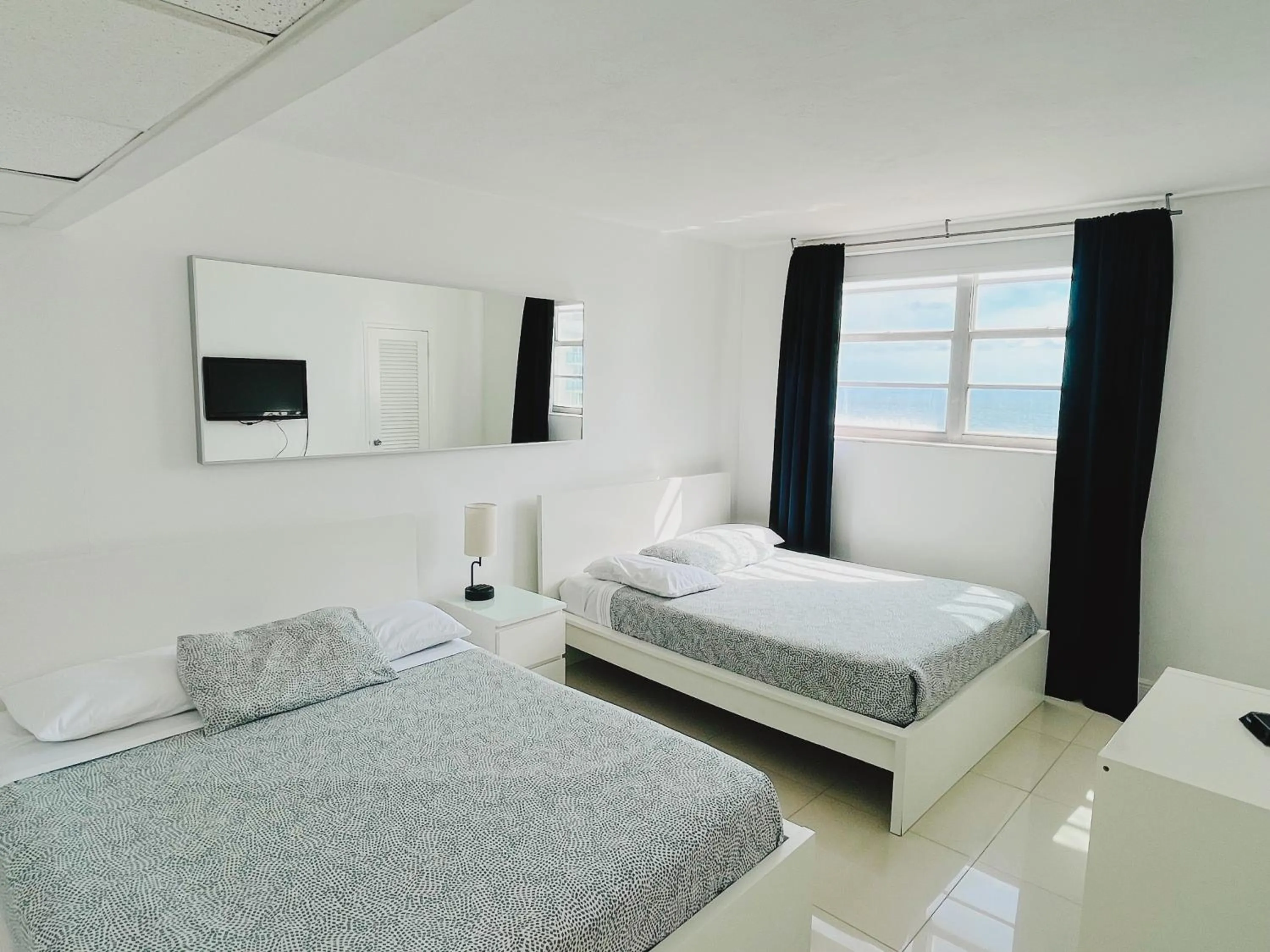 Bed in Miami Hallandale Condo, Partial Ocean View Direct Beach and Pool Access Miami Hollywood Beach