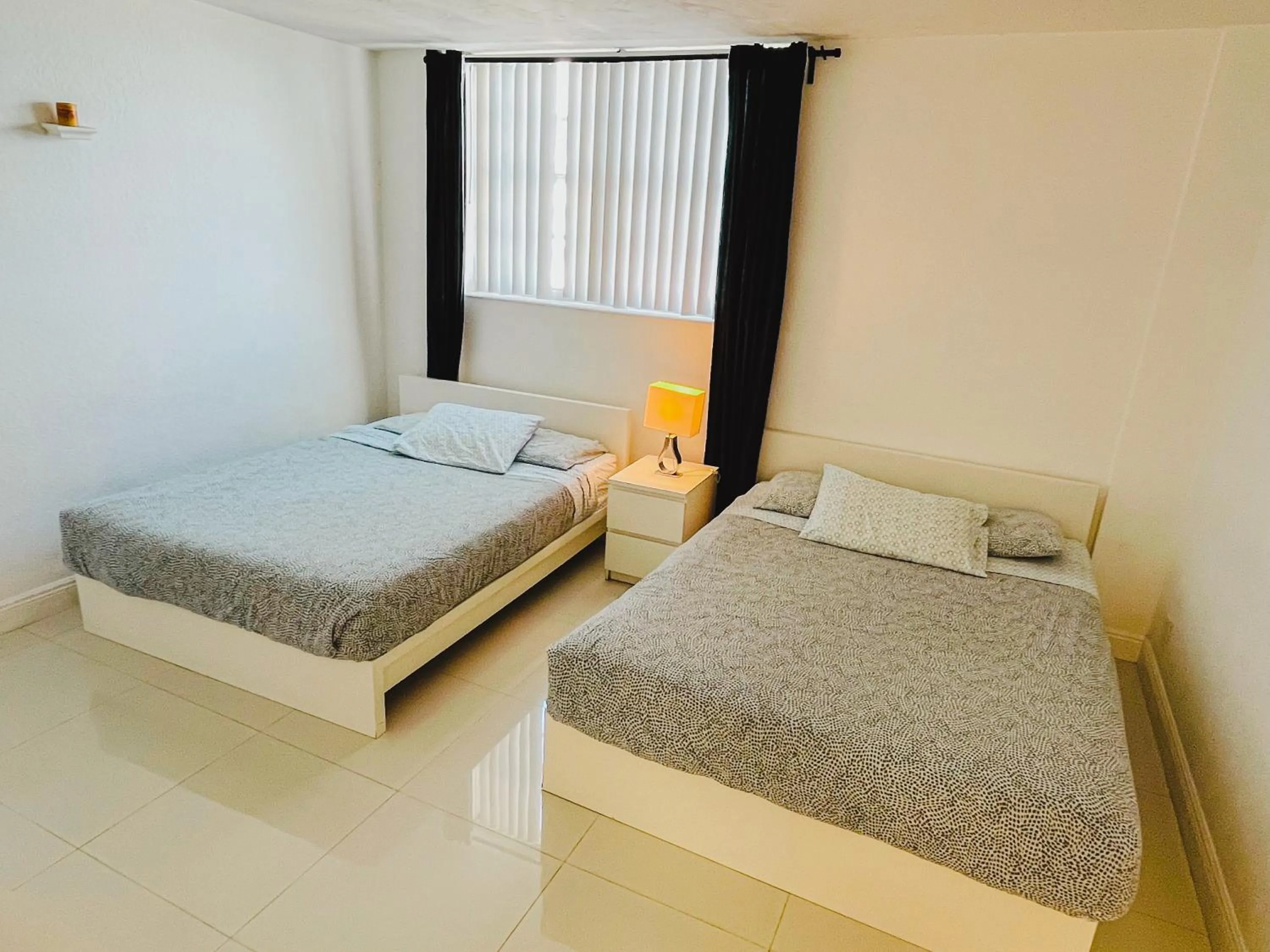 Bed in Miami Hallandale Condo, Partial Ocean View Direct Beach and Pool Access Miami Hollywood Beach