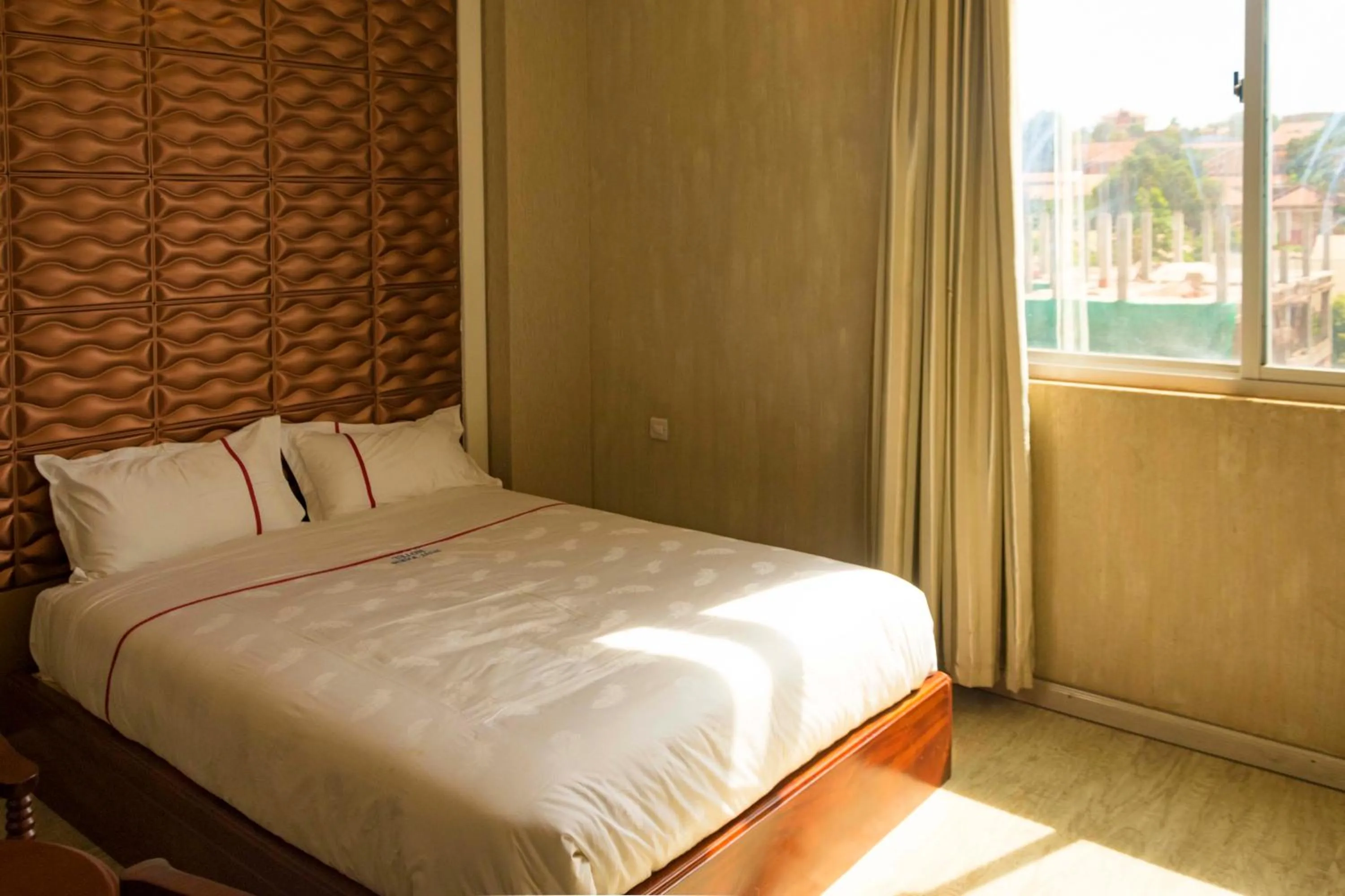 Bed in Freedom City Hotel Najjanankumbi Kamapala