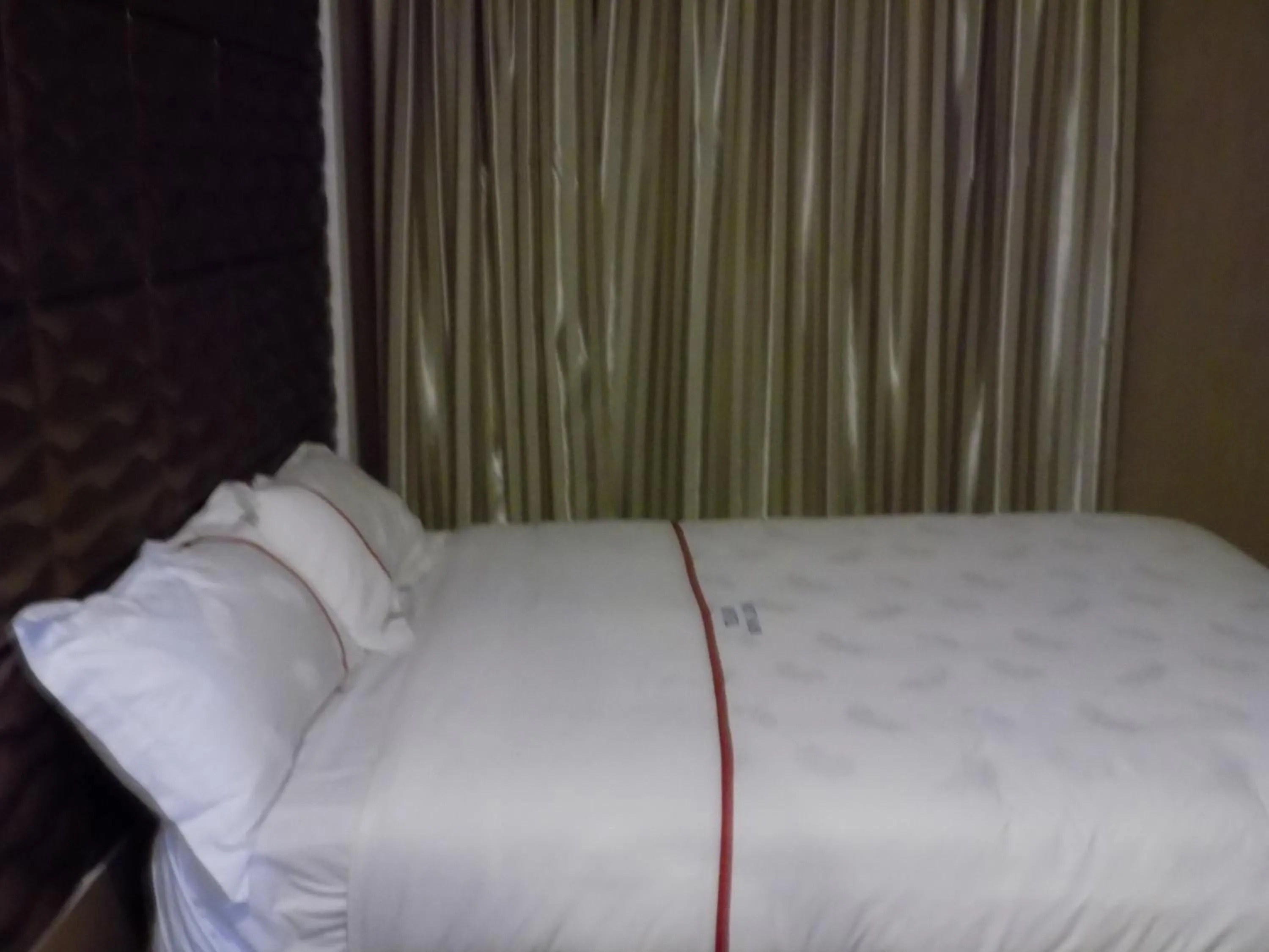 Bedroom in Freedom City Hotel Najjanankumbi Kamapala