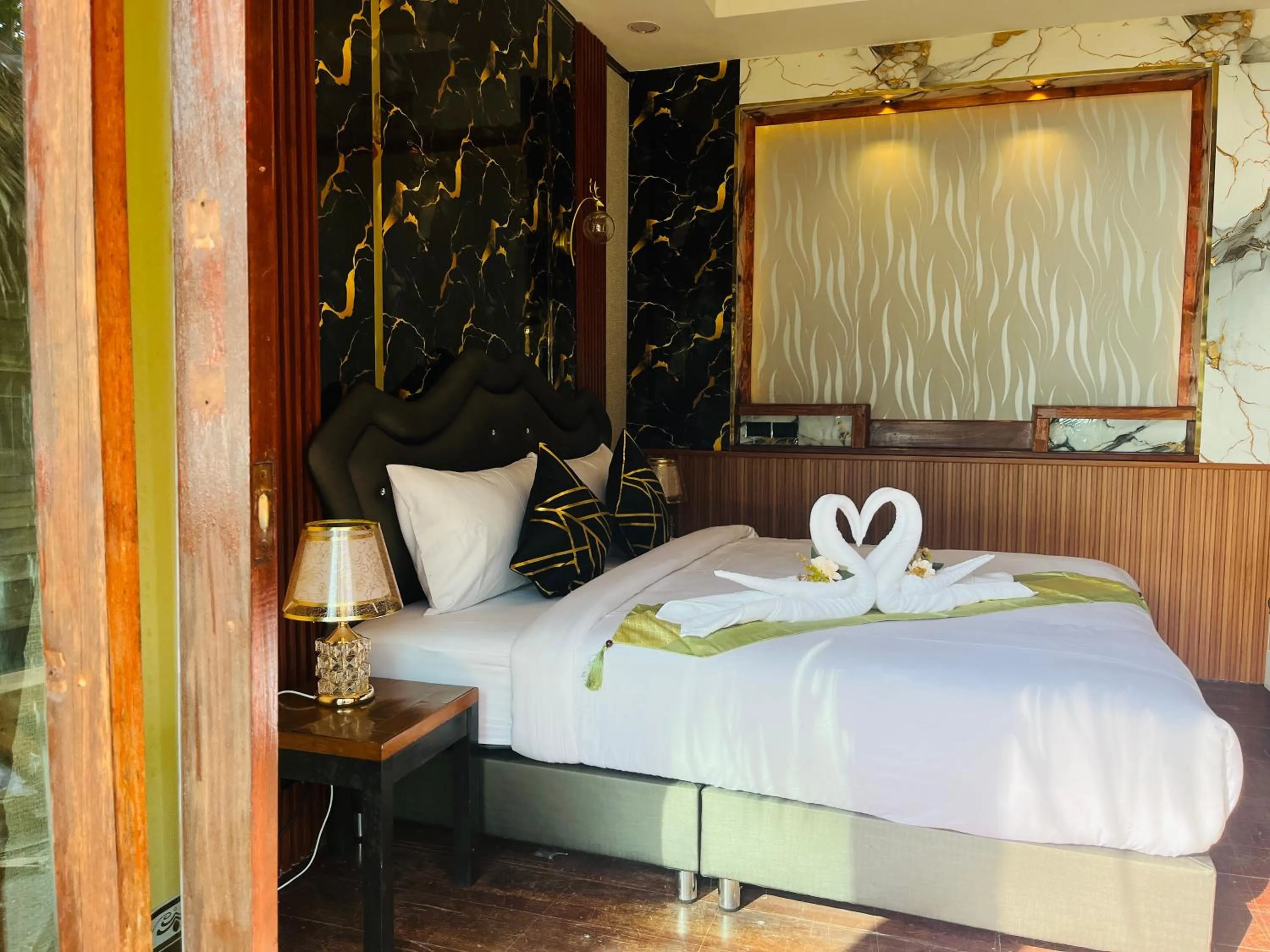 Bed in New Ozone Resort & Spa