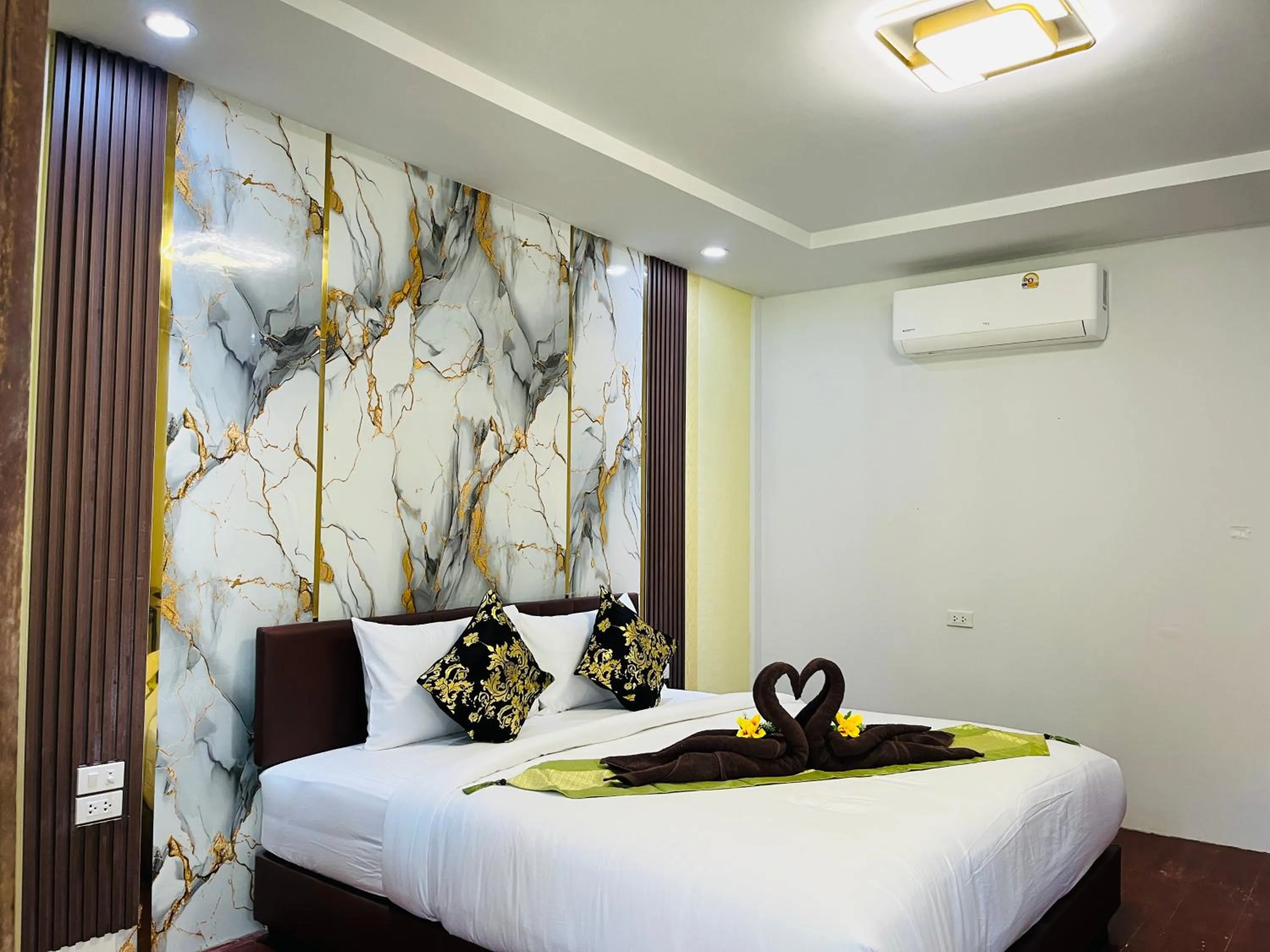 Bed in New Ozone Resort & Spa