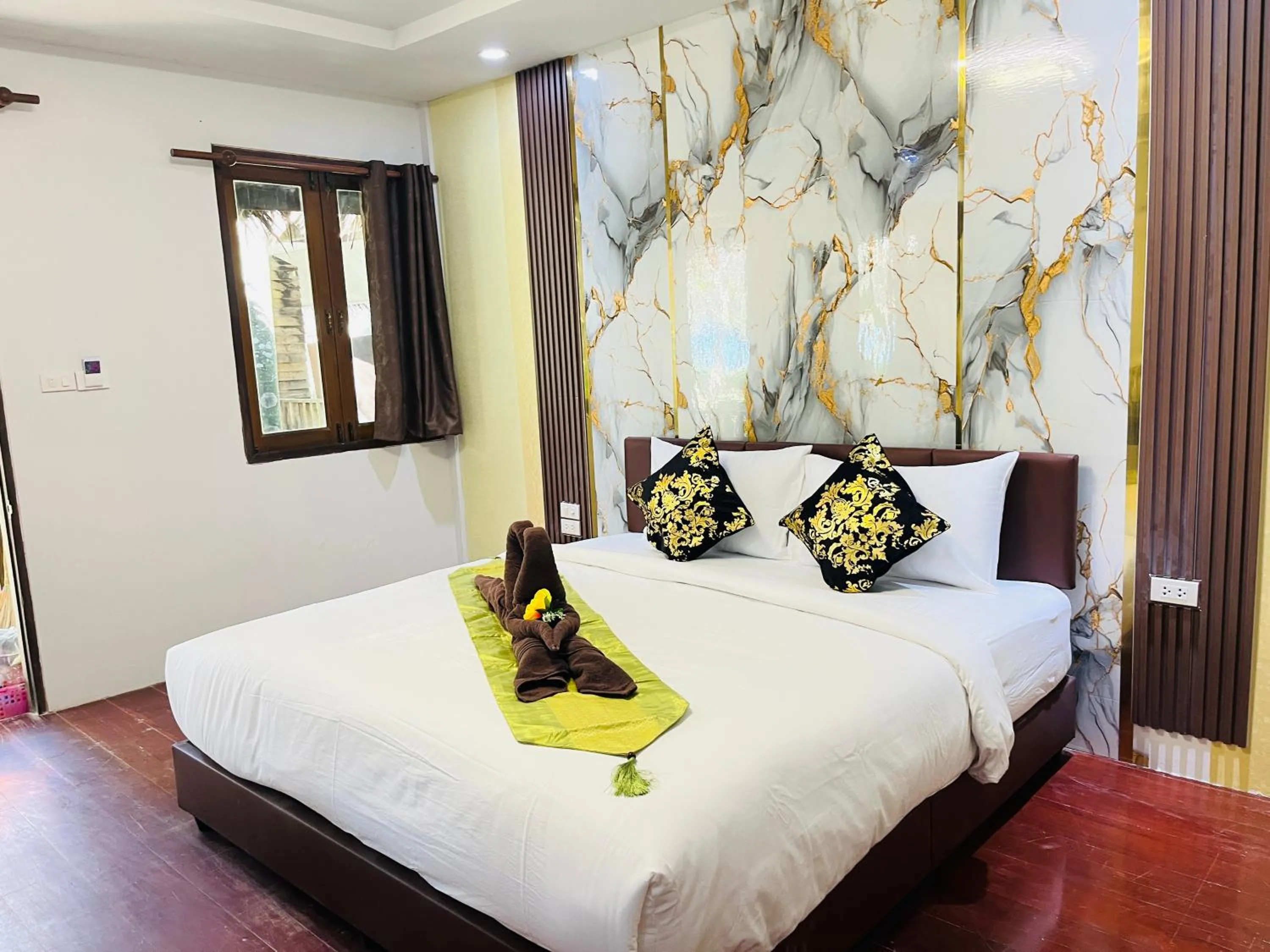 Bed in New Ozone Resort & Spa