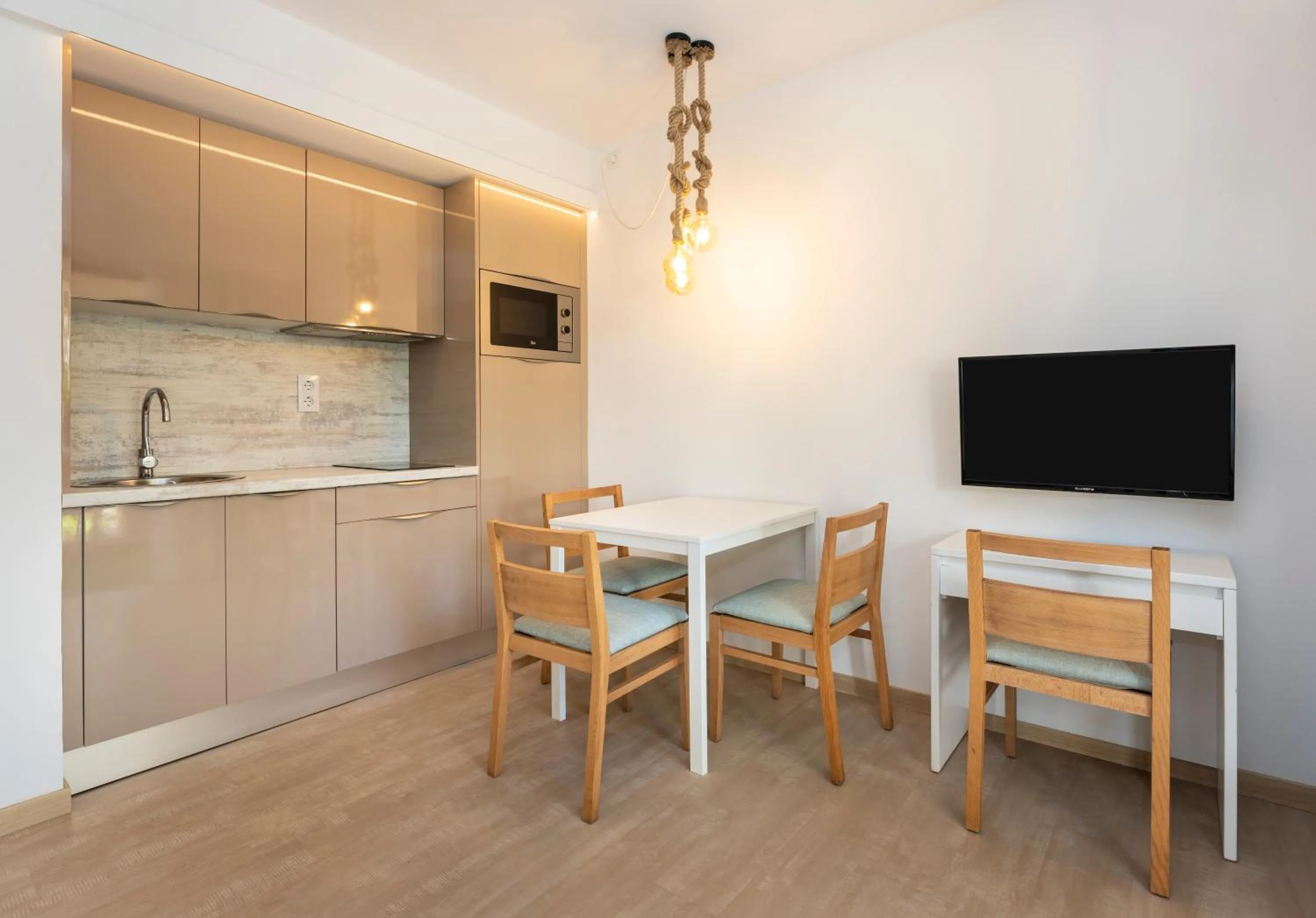 Kitchen or kitchenette in Apartamentos S'Olivera