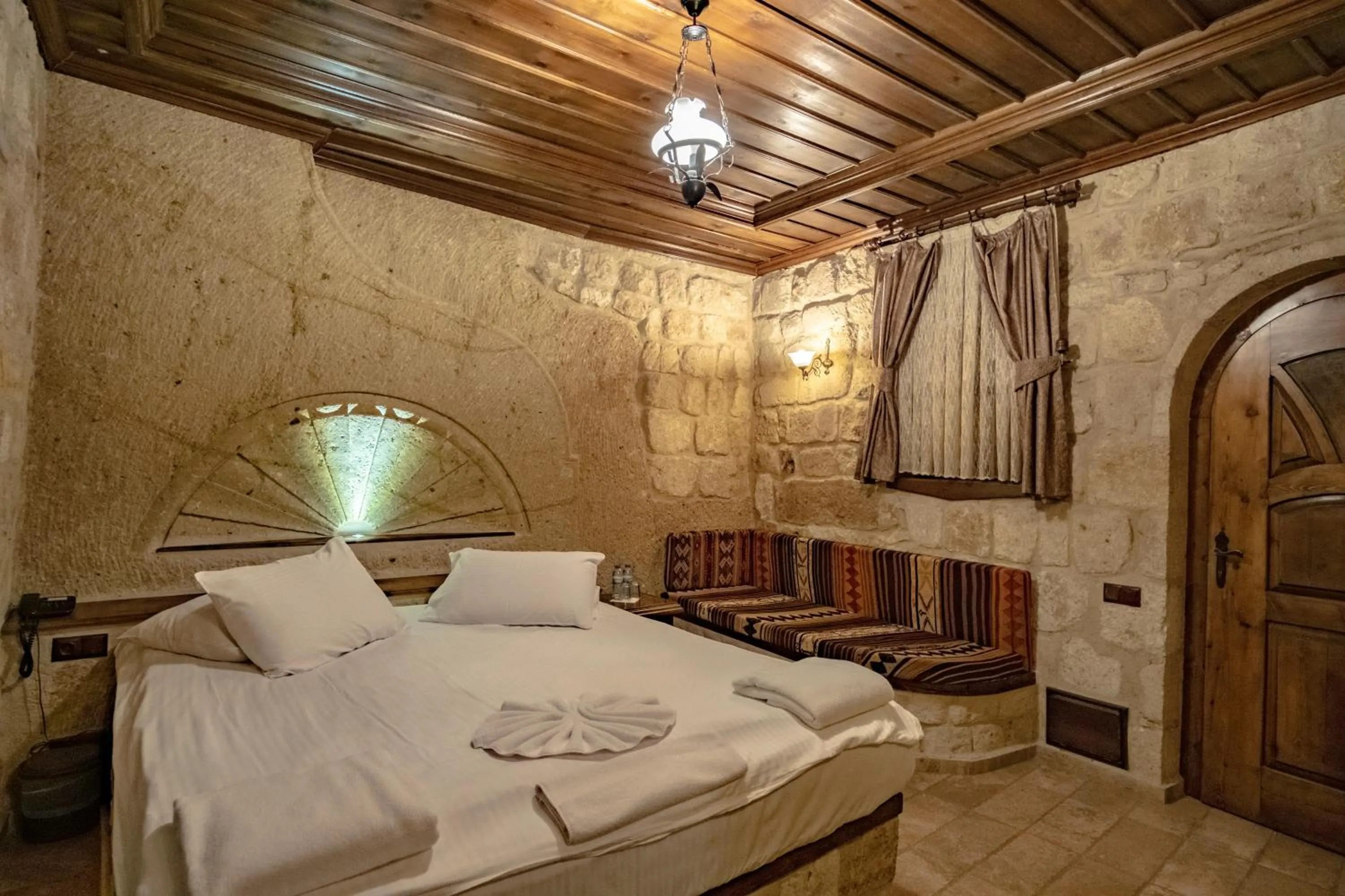 Bed in Kemerhan Cave Suites
