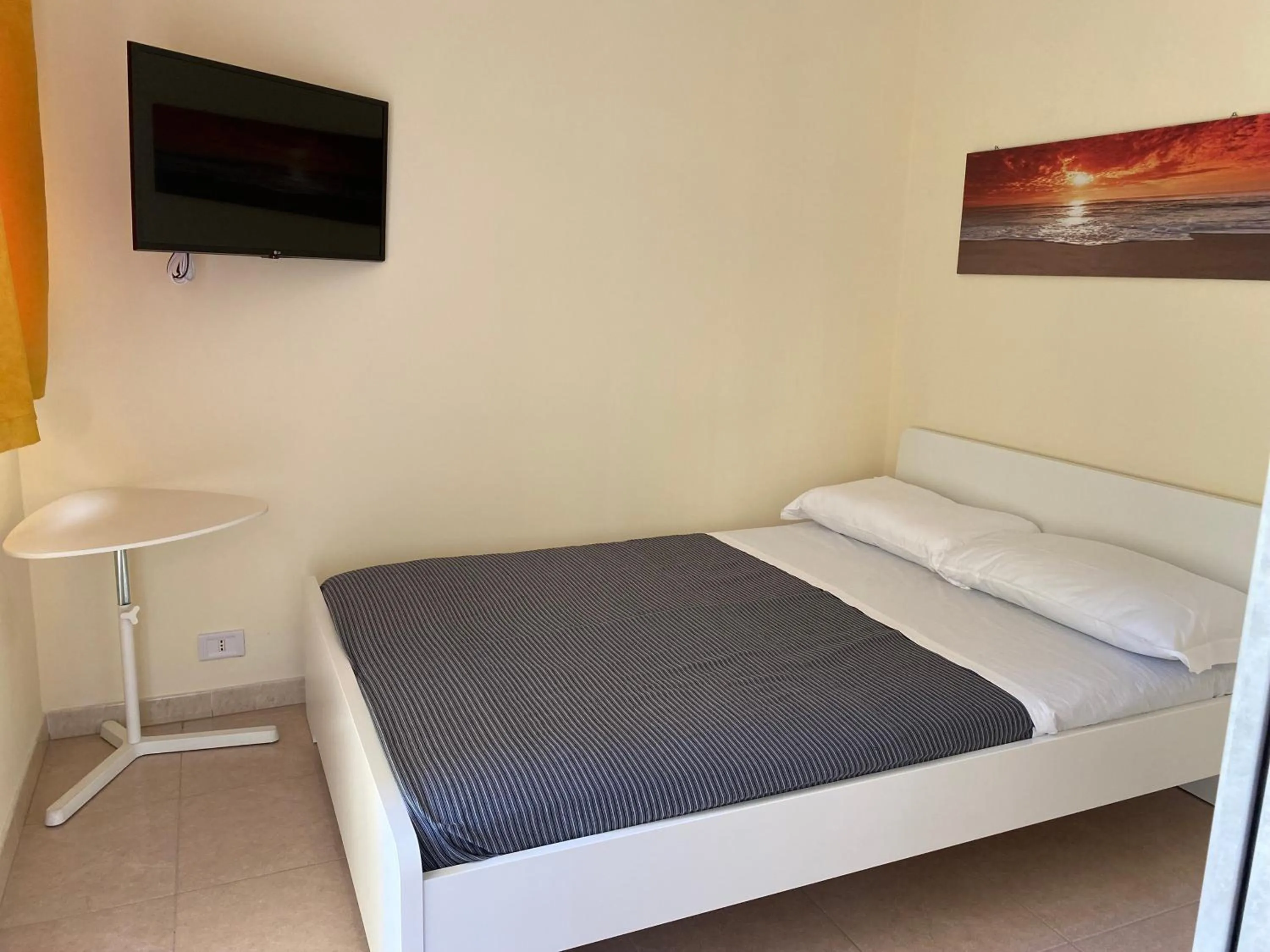 Bed in VILLA ADELAIDE SUITE & ROOM