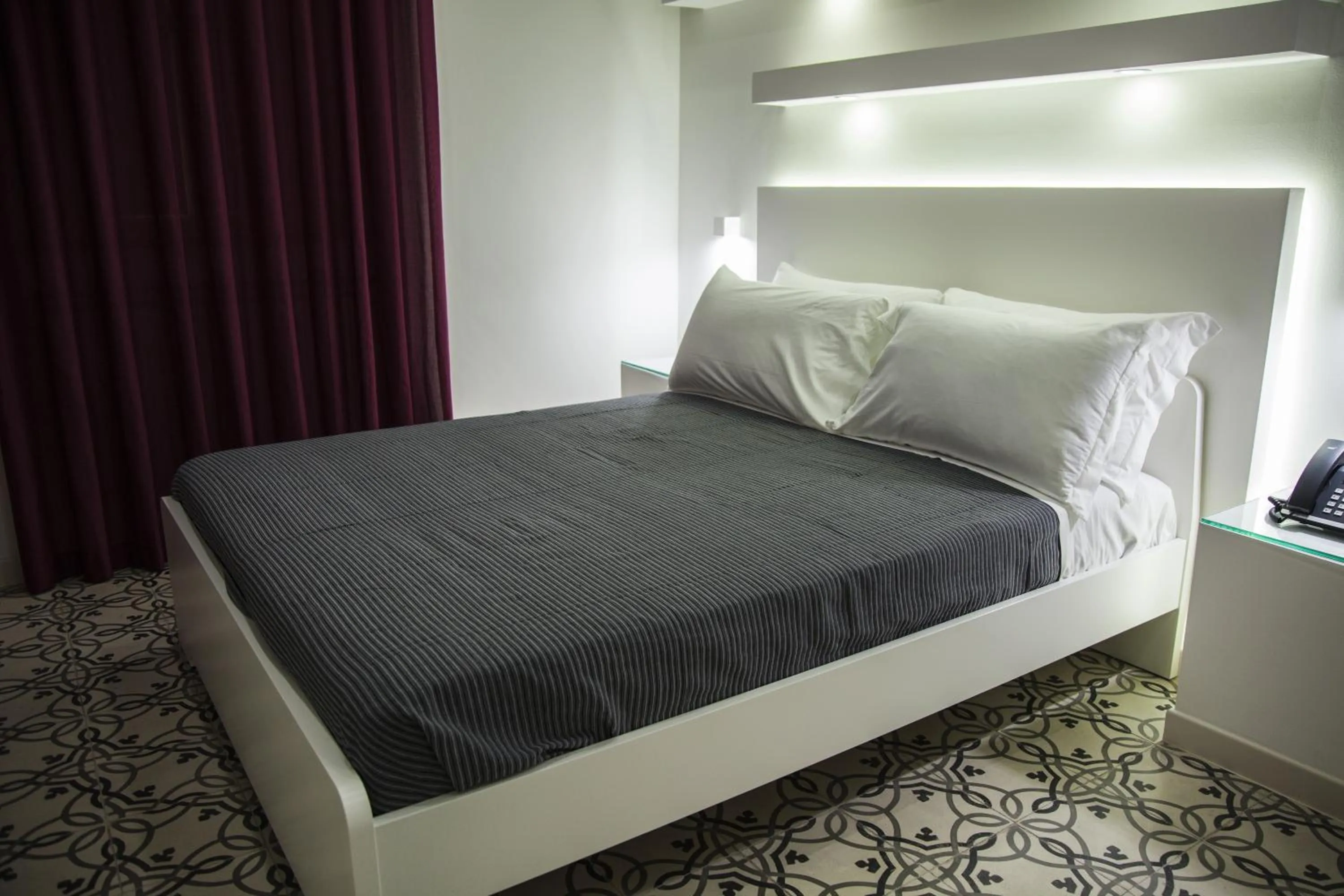 Bed in VILLA ADELAIDE SUITE & ROOM