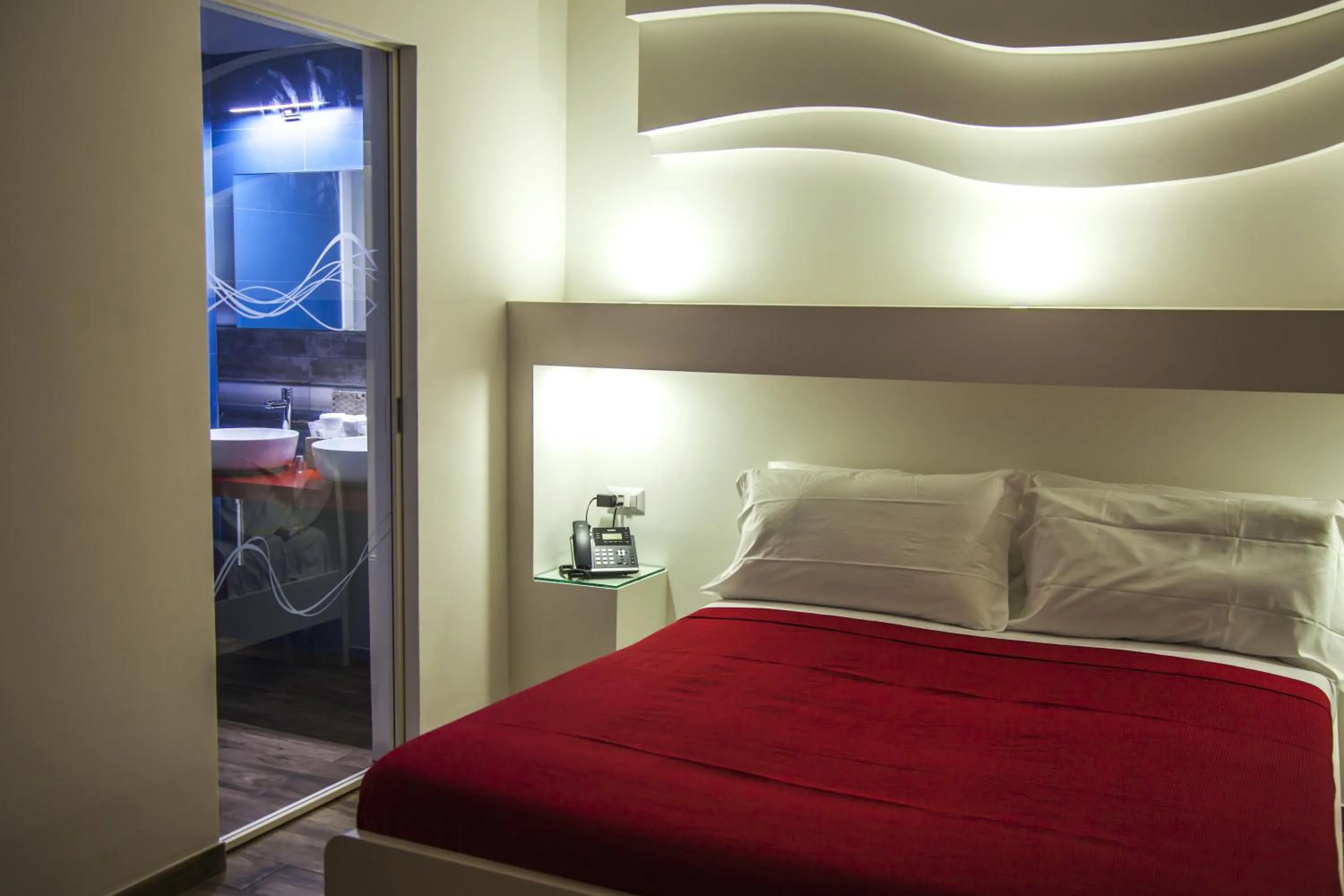 Bed in VILLA ADELAIDE SUITE & ROOM