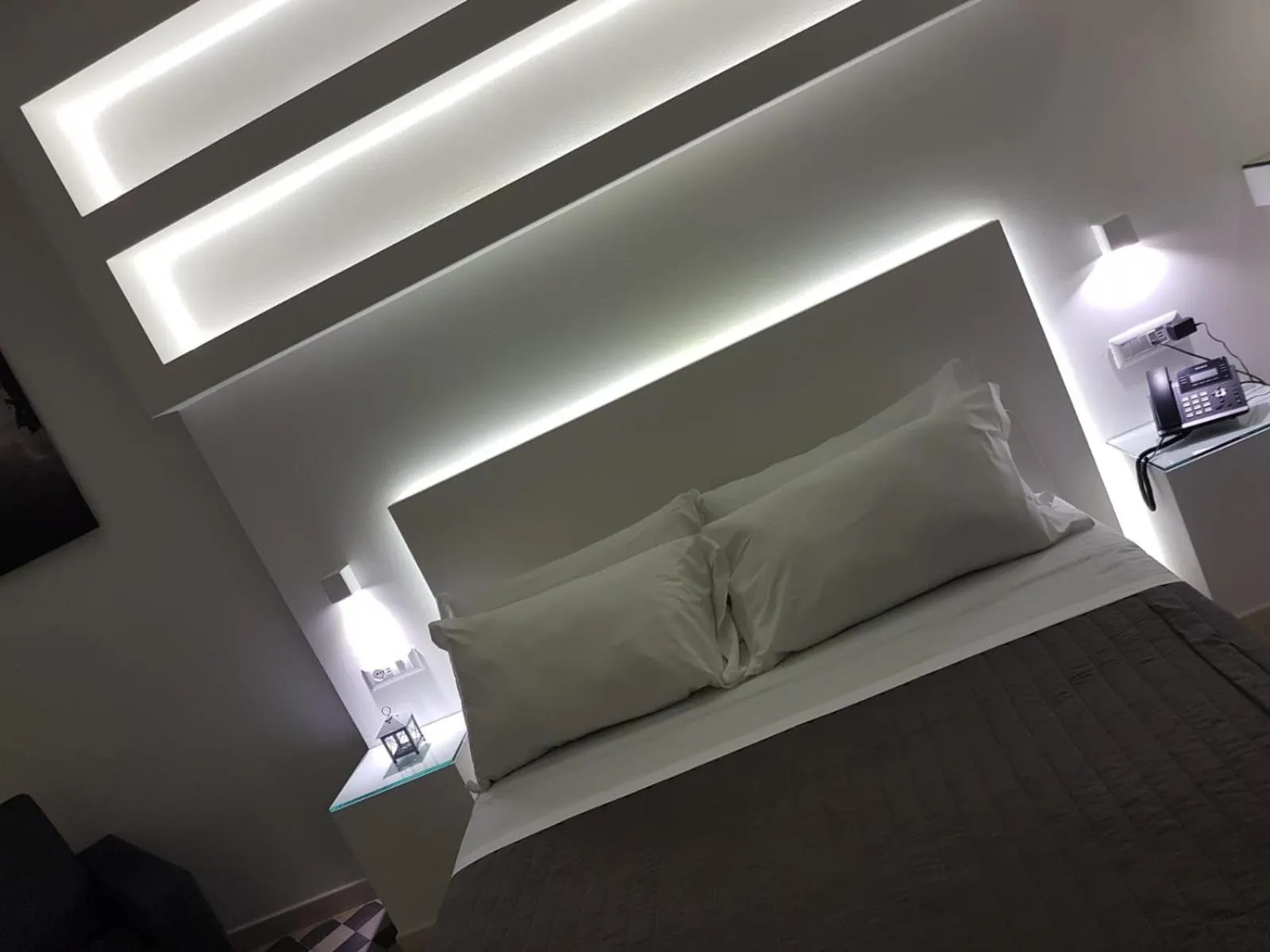 Bed in VILLA ADELAIDE SUITE & ROOM