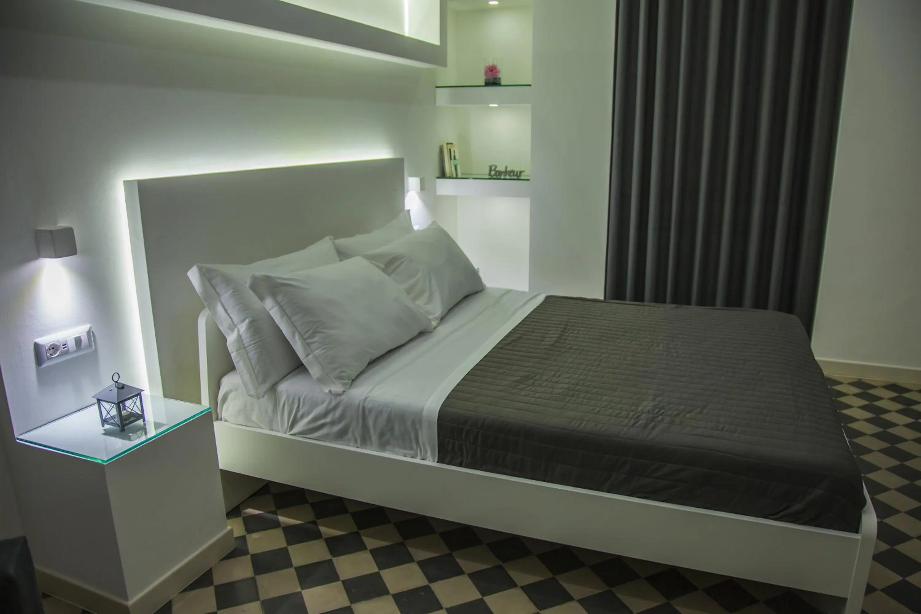 Bed in VILLA ADELAIDE SUITE & ROOM