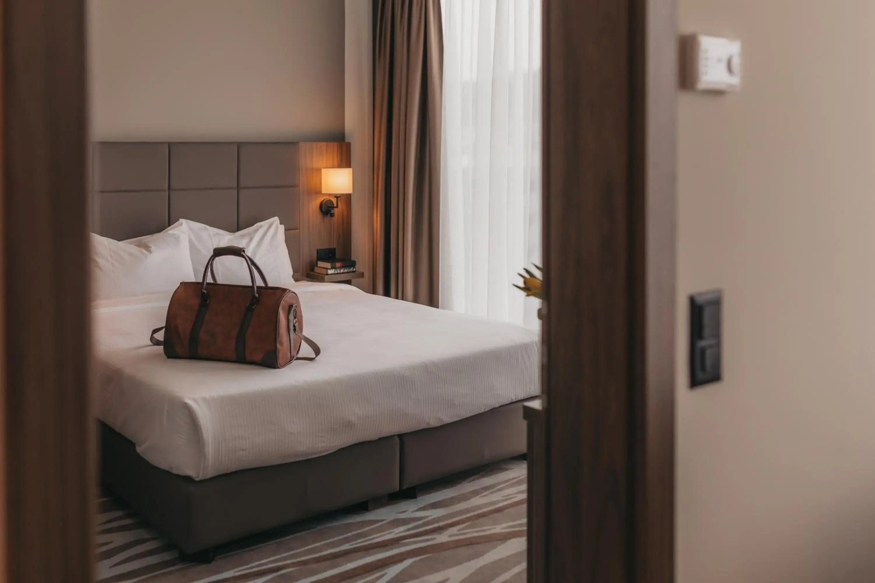 Decorative detail, Bed in IIP Apartments - Self Check-In Decorative detail, Bed in IIP Apartments - Self Check-In