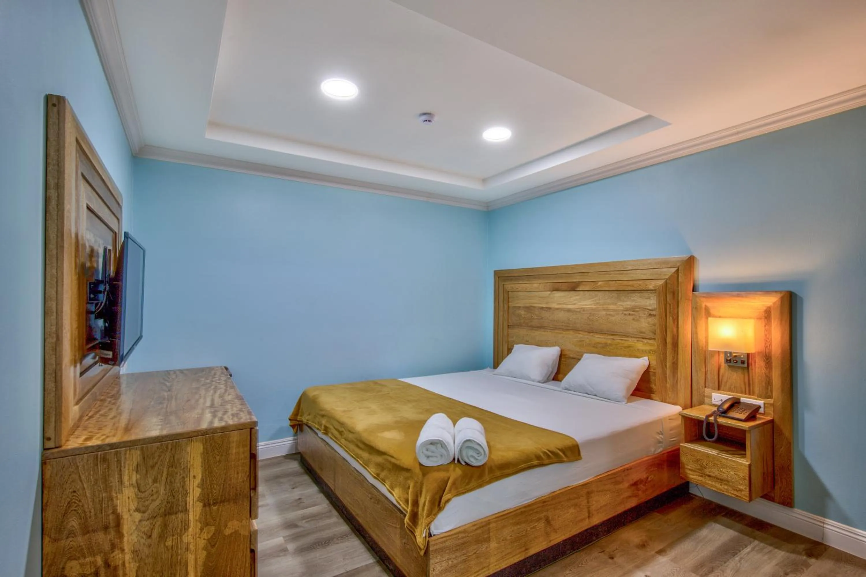 Bed in Airport Suites Hotel