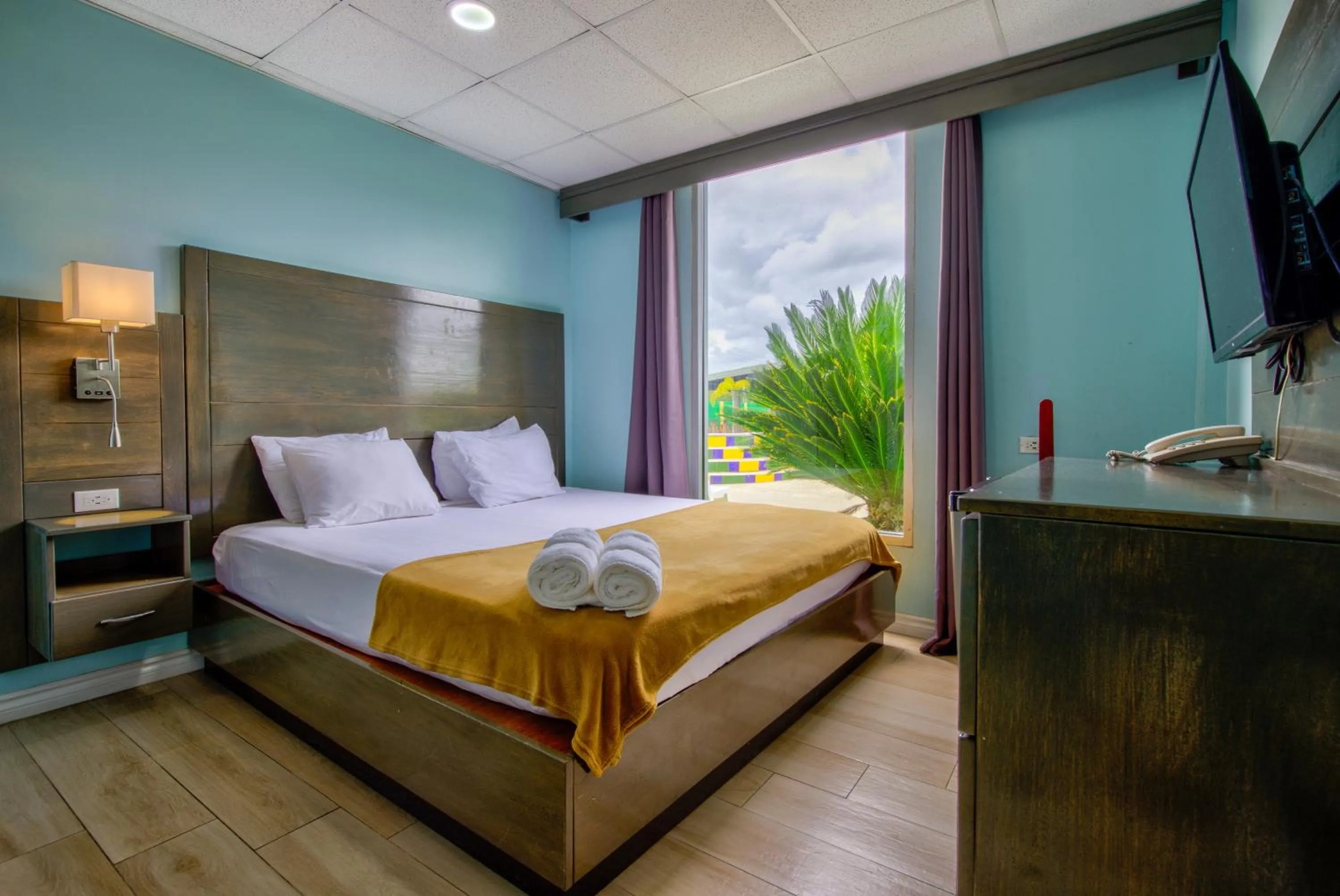 Bed in Airport Suites Hotel