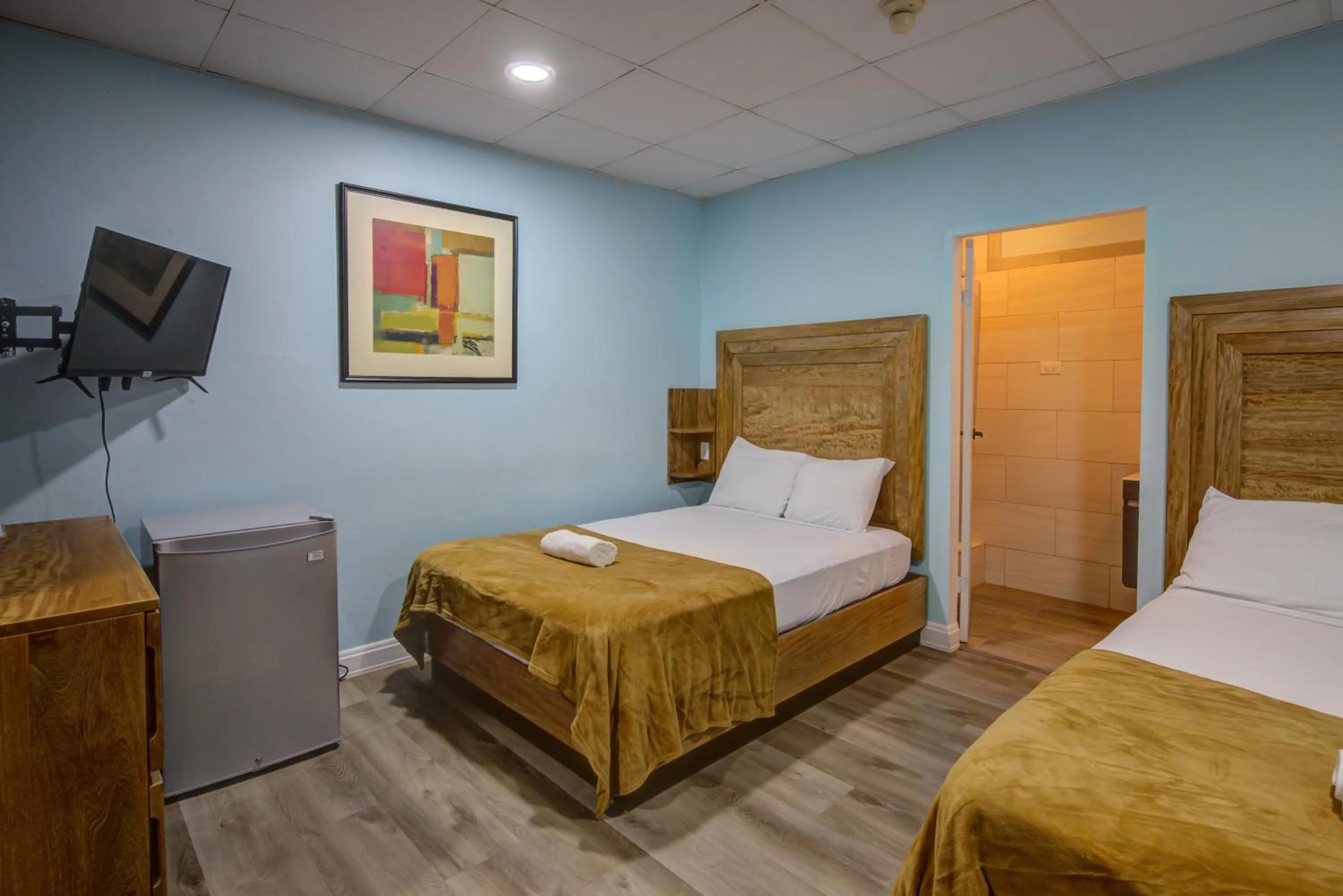 Bed in Airport Suites Hotel