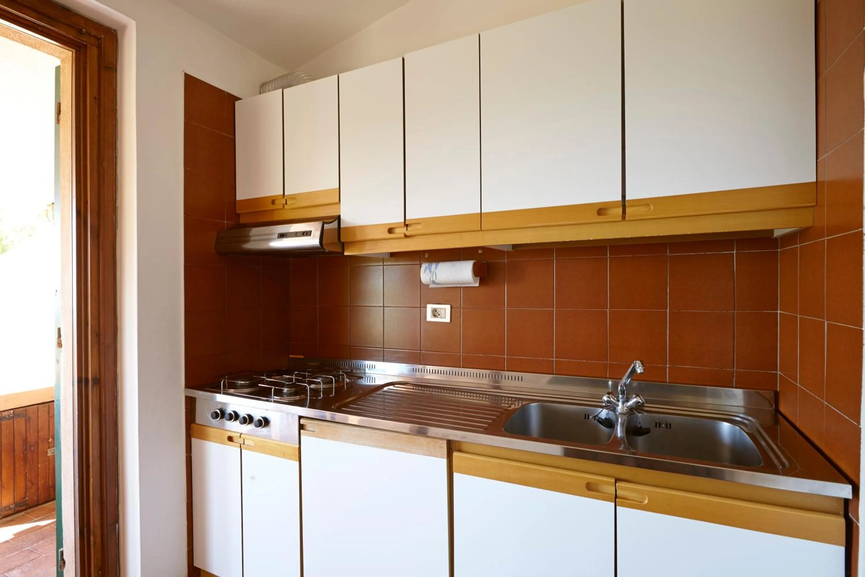 Kitchen or kitchenette in Residence Baia Salinedda