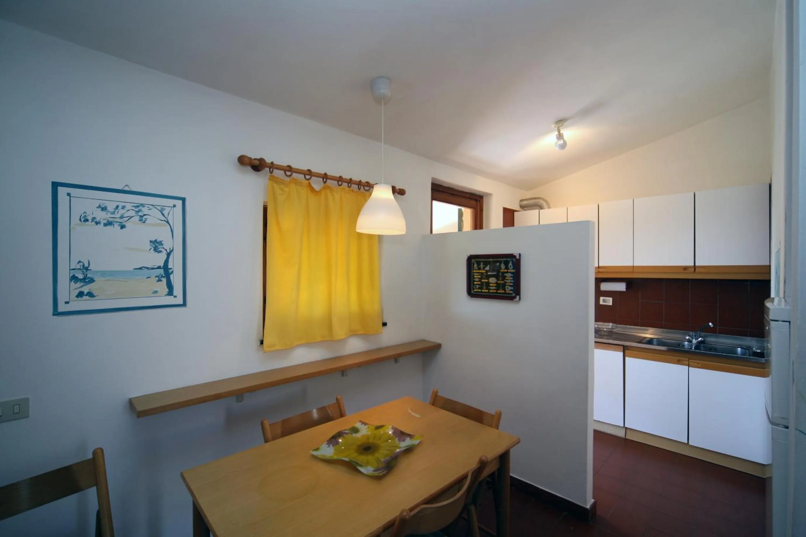 Kitchen or kitchenette in Residence Baia Salinedda