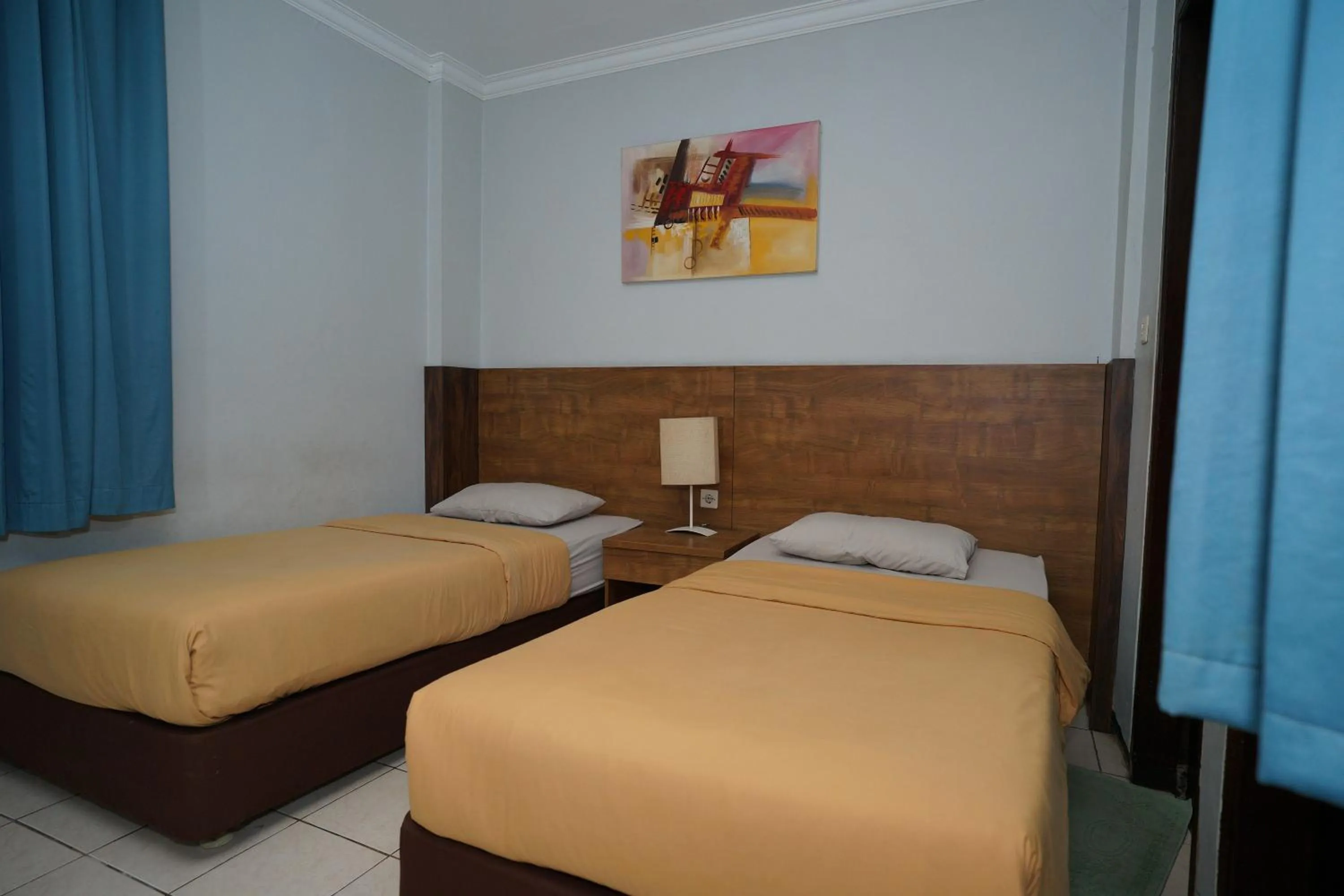 Bed in Hotel Puri Pangalengan