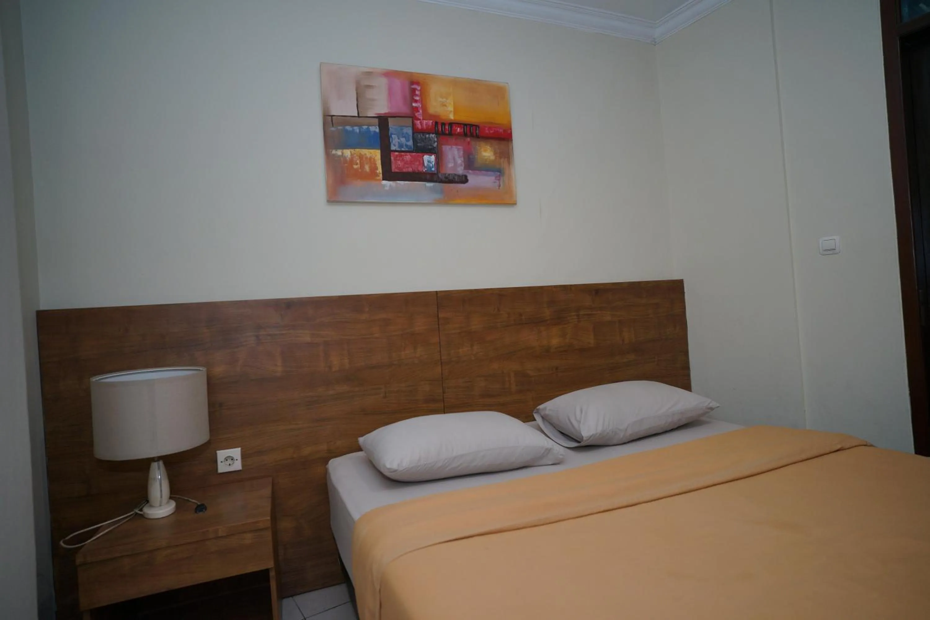 Bed in Hotel Puri Pangalengan