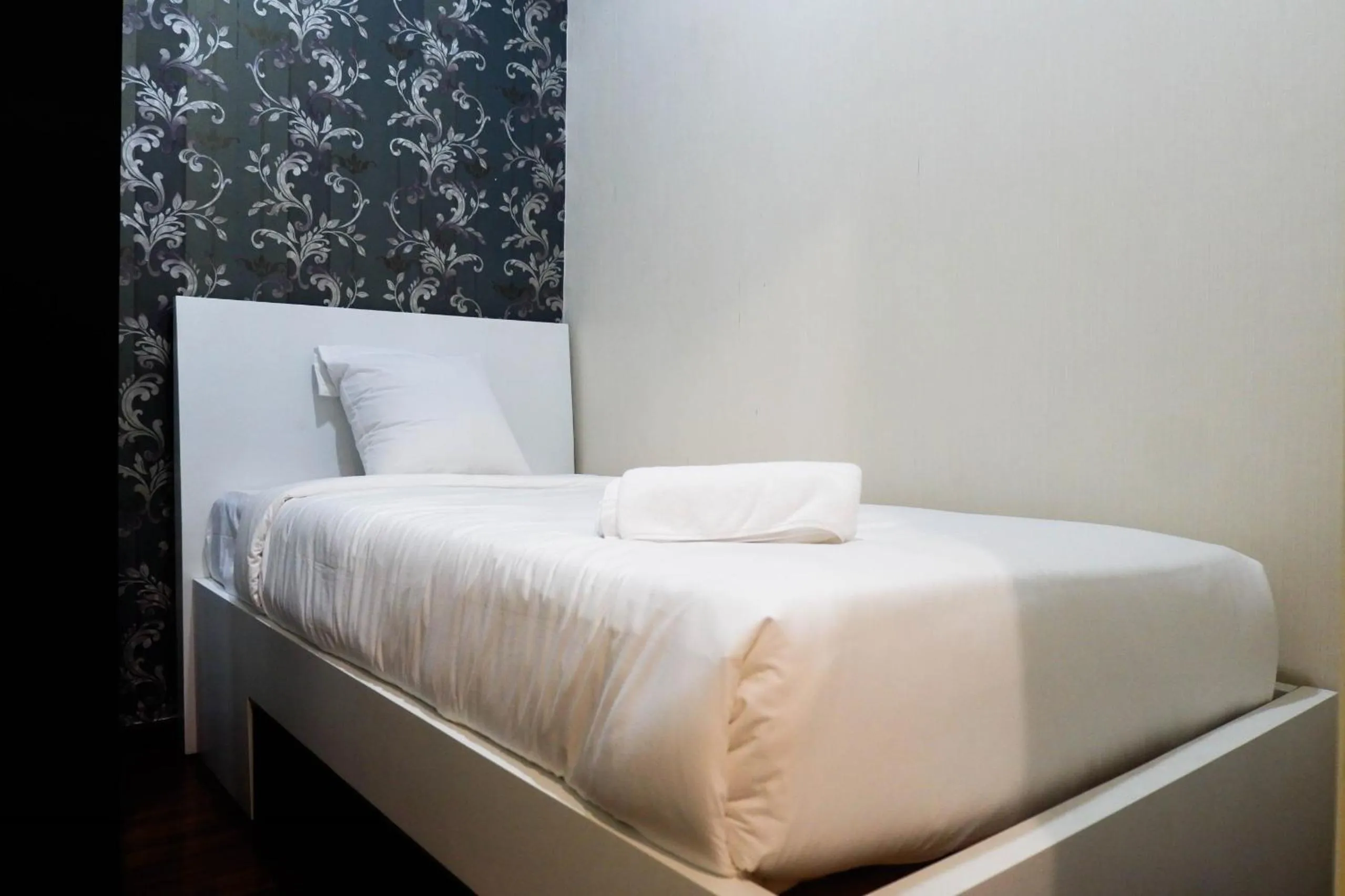Bed in Strategic 2BR Apartment at Trillium Residence By Travelio