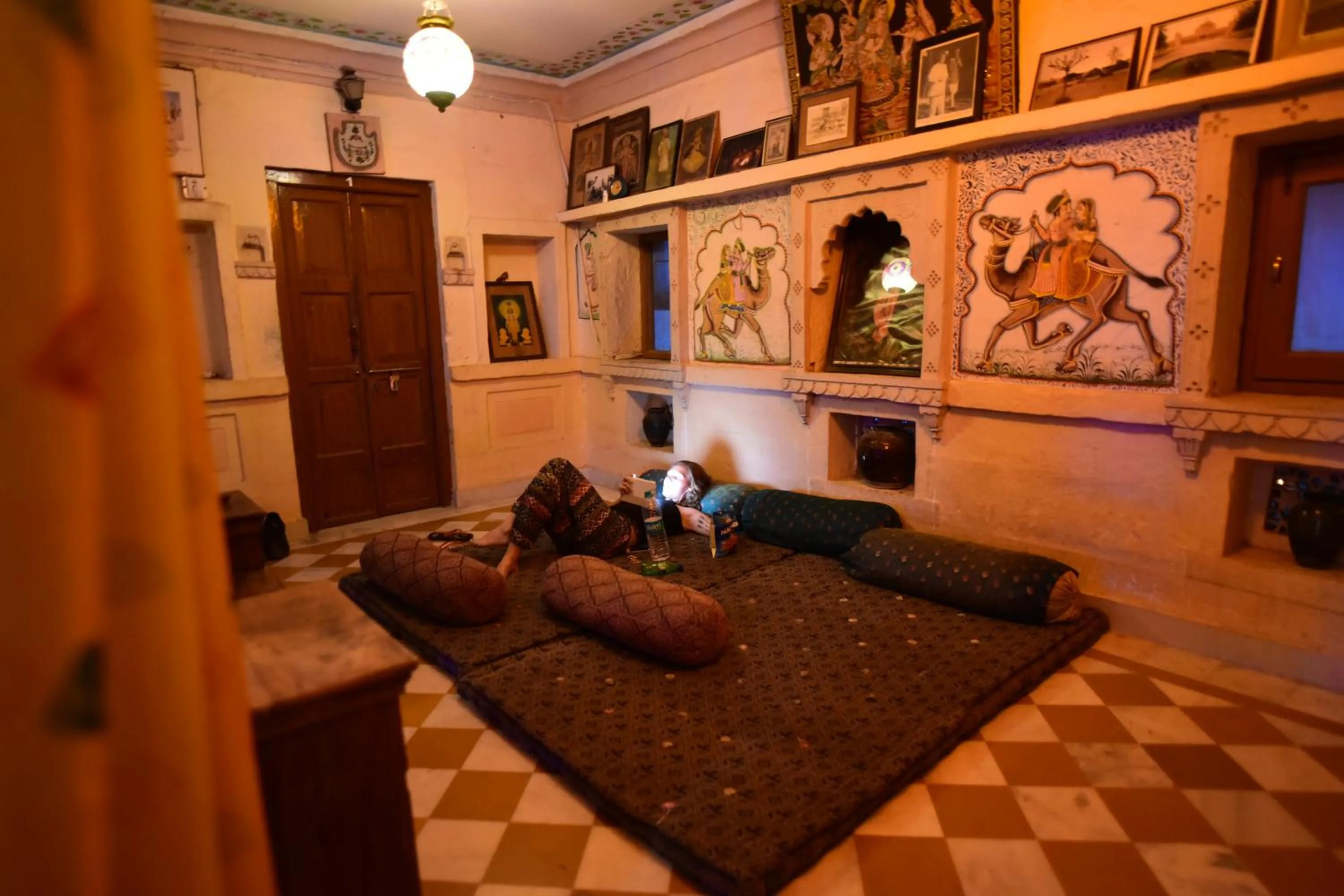 Seating area, Bed in Yogis Guest House
