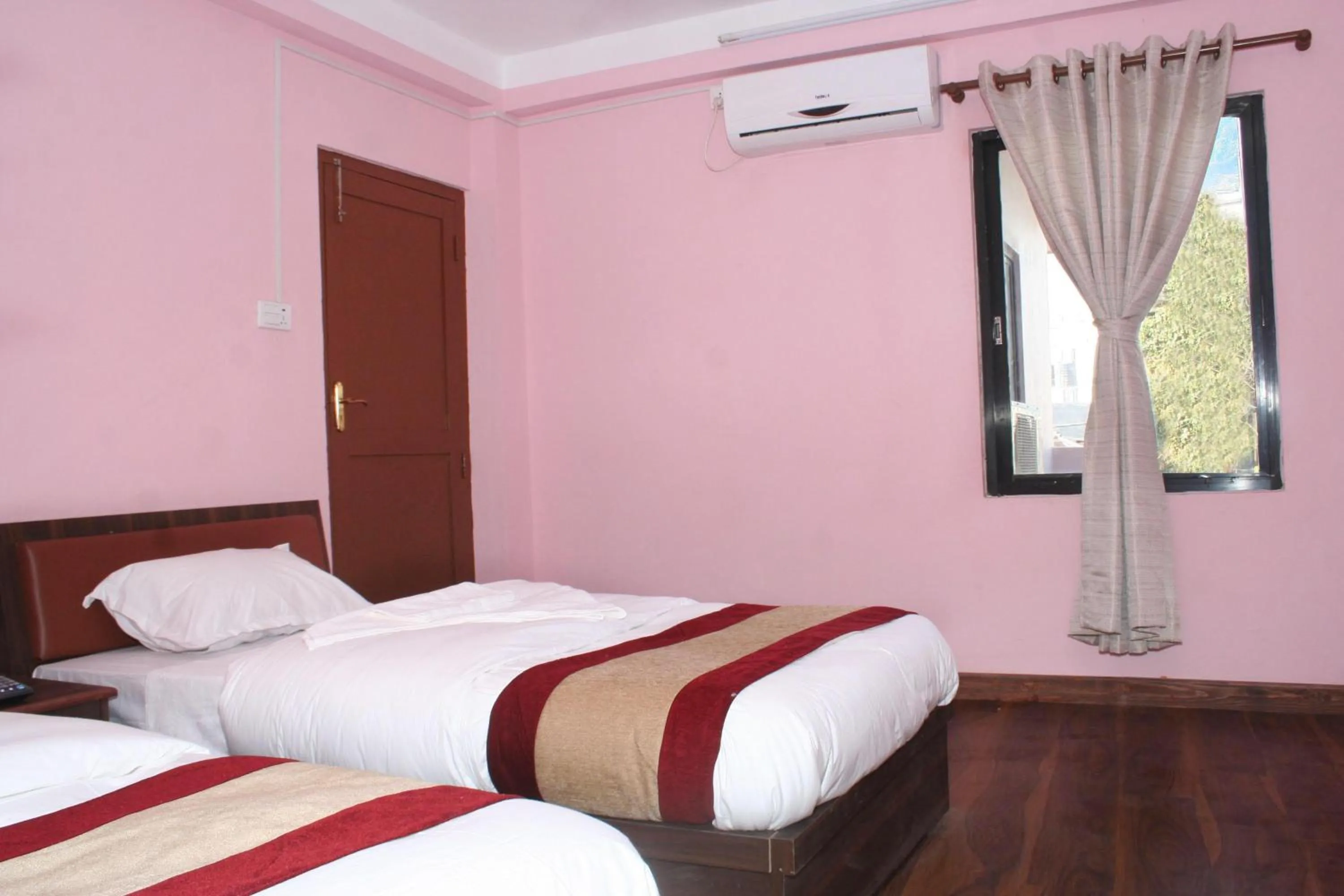 Bed in Sitapaila Home Stay and Apartment