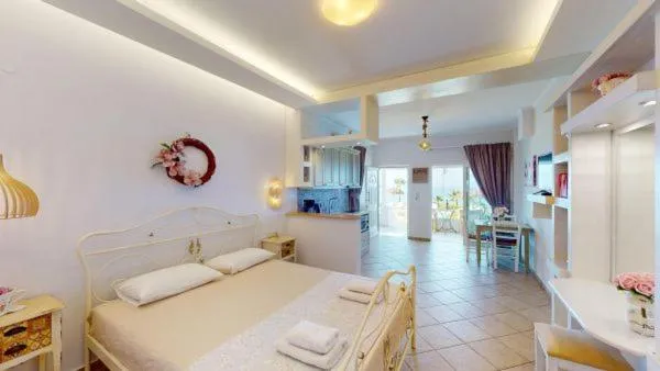 Kitchen or kitchenette, Bed in Aneria Suites