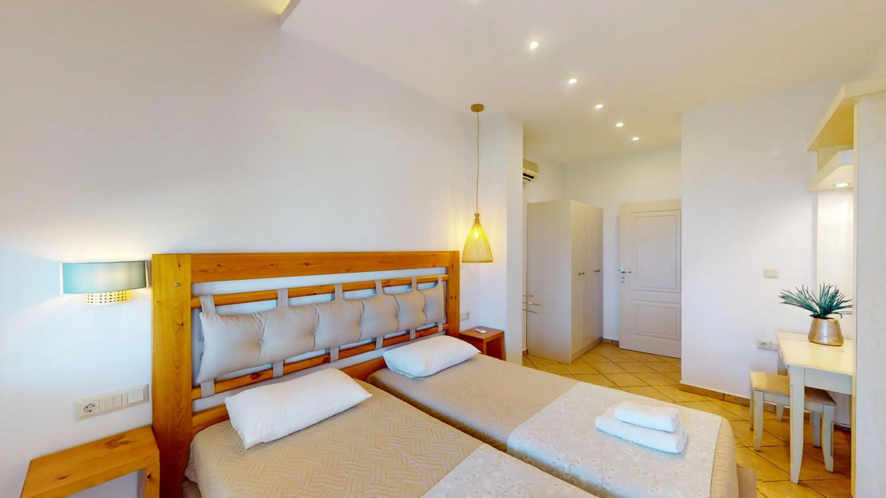 Bed in Aneria Suites