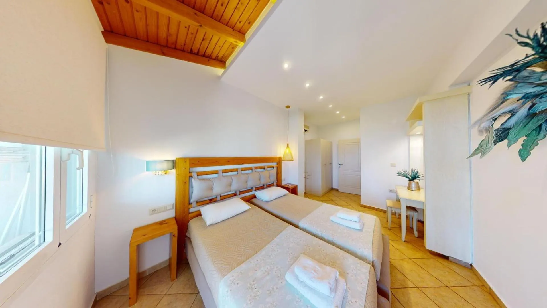 Bed in Aneria Suites