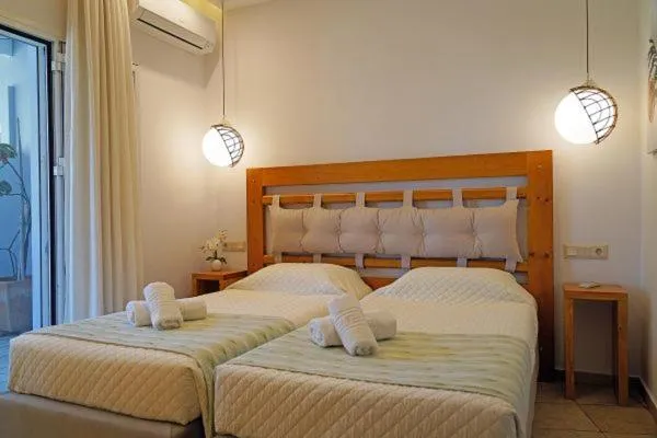 Bed in Aneria Suites
