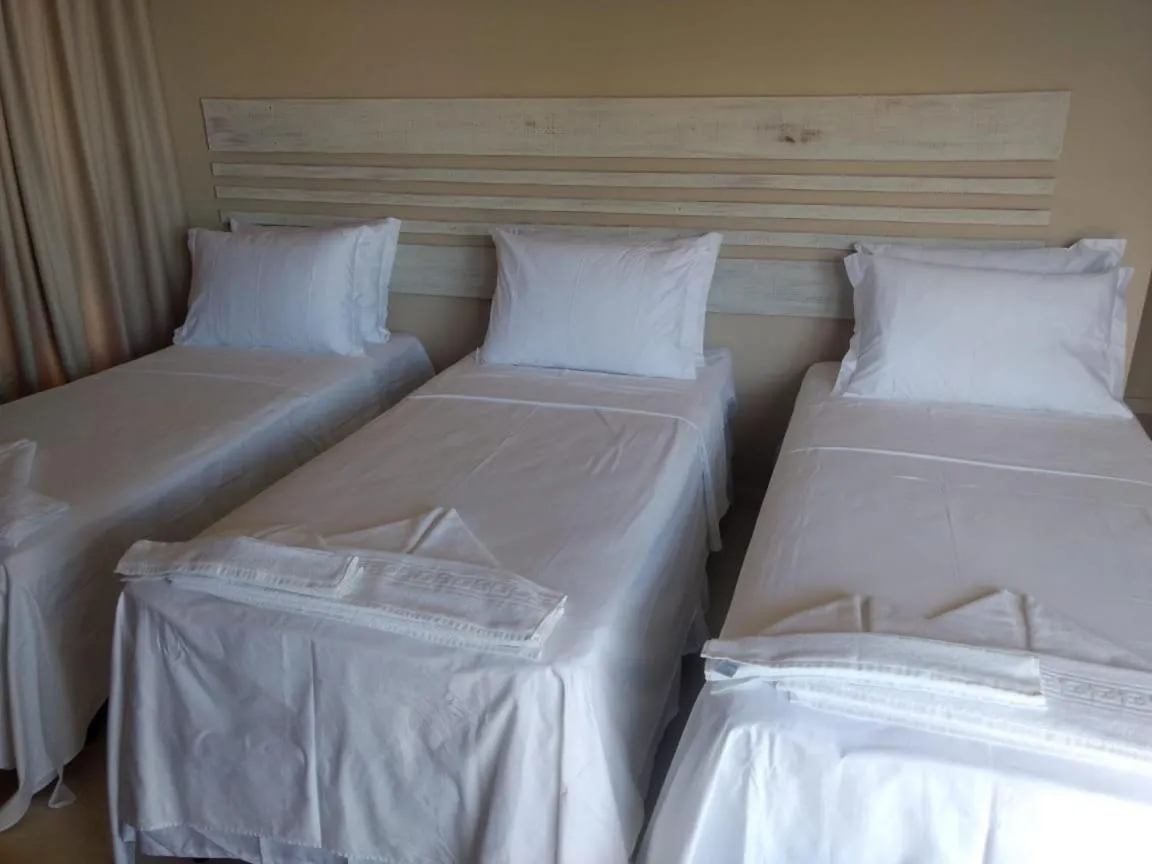 Bed in RANCHO GOSTOSO POUSADA
