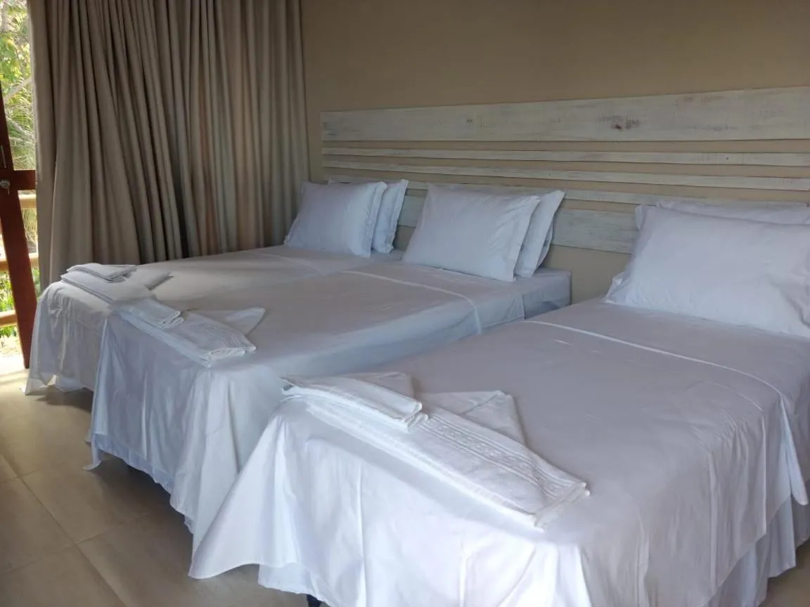 Bed in RANCHO GOSTOSO POUSADA